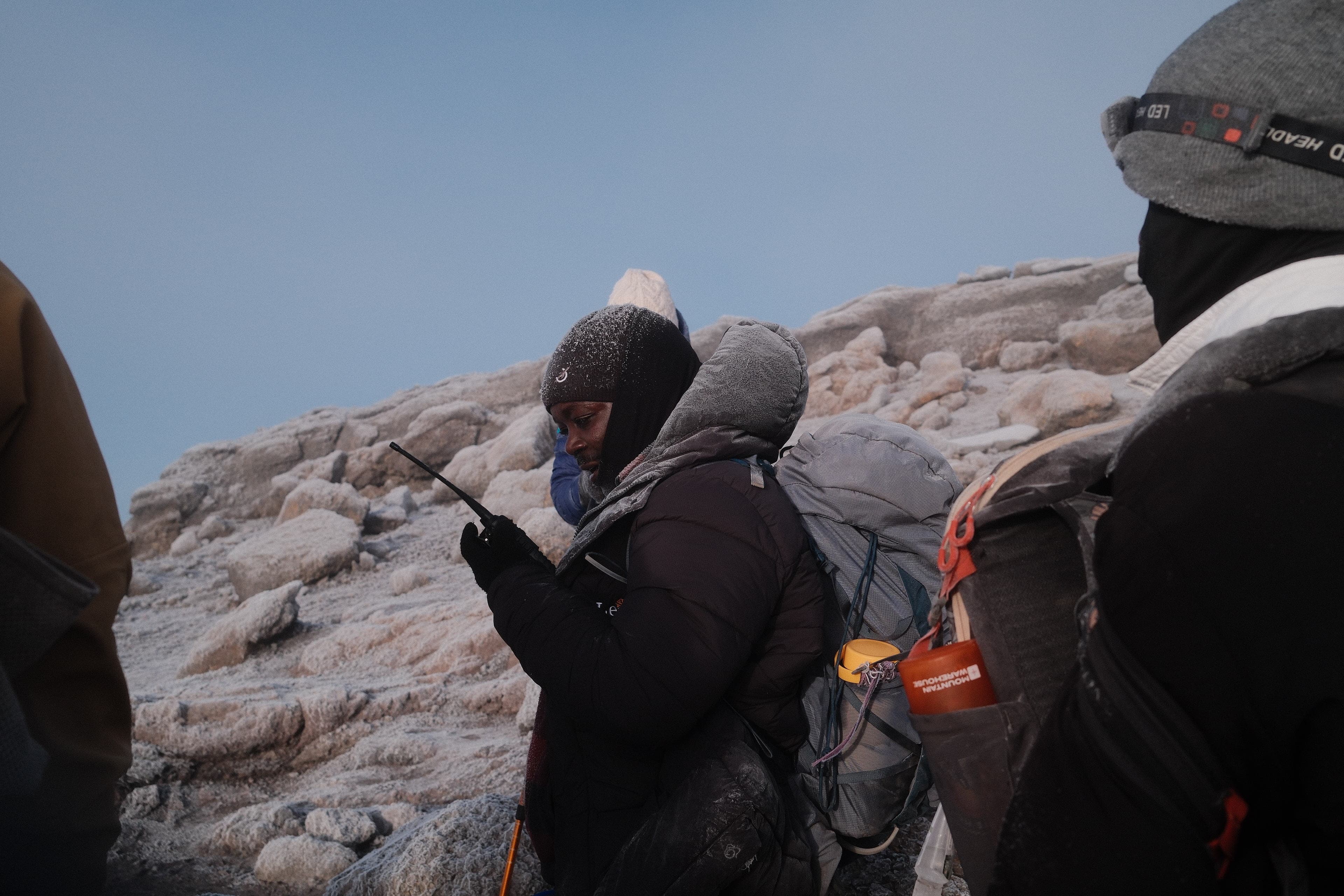 Legend guides and climbers at Barafu high camp before a summit attempt on Kilimanjaro.