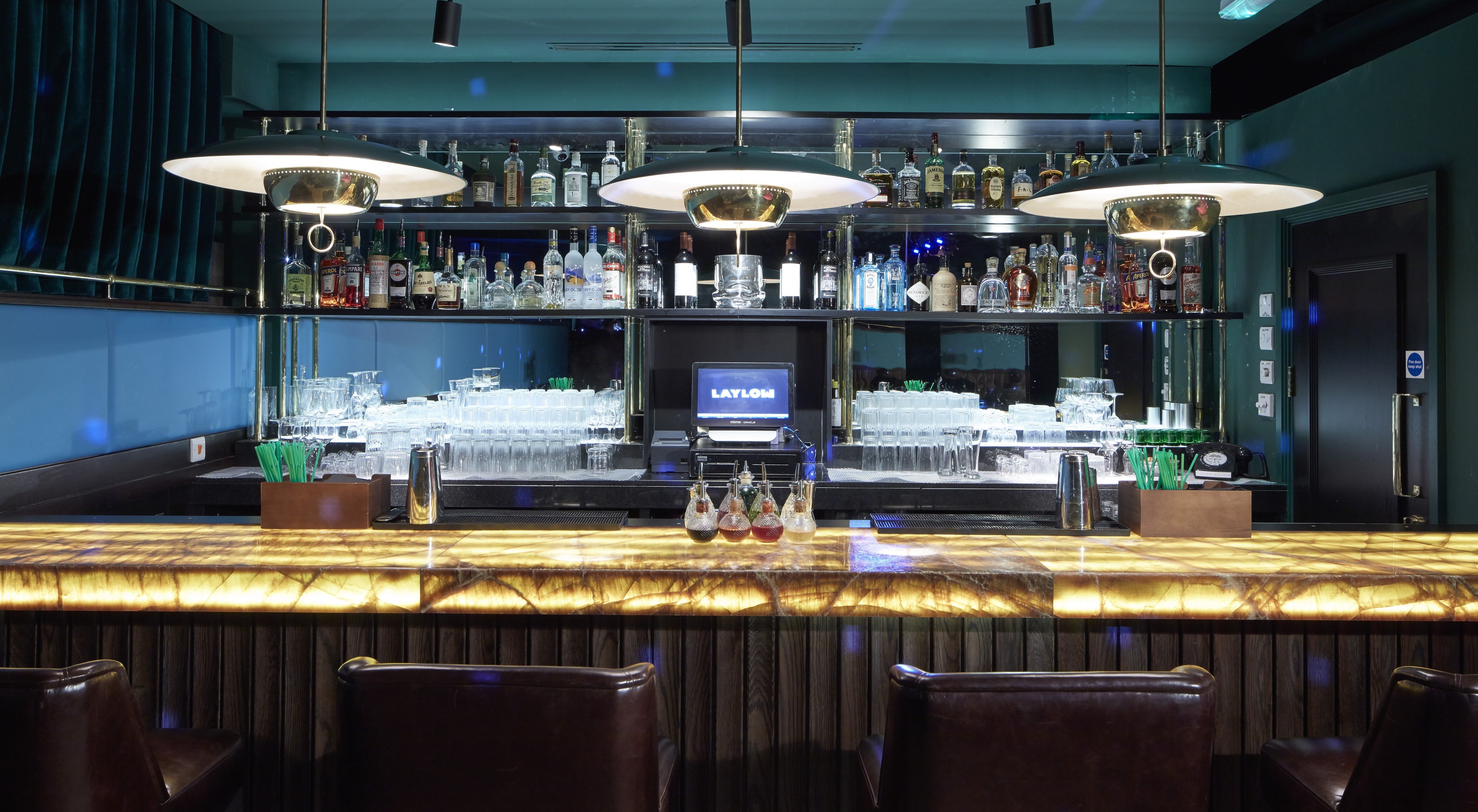 LayLow London members club bar with illuminated onyx counter and bespoke joinery by Matrix IDC