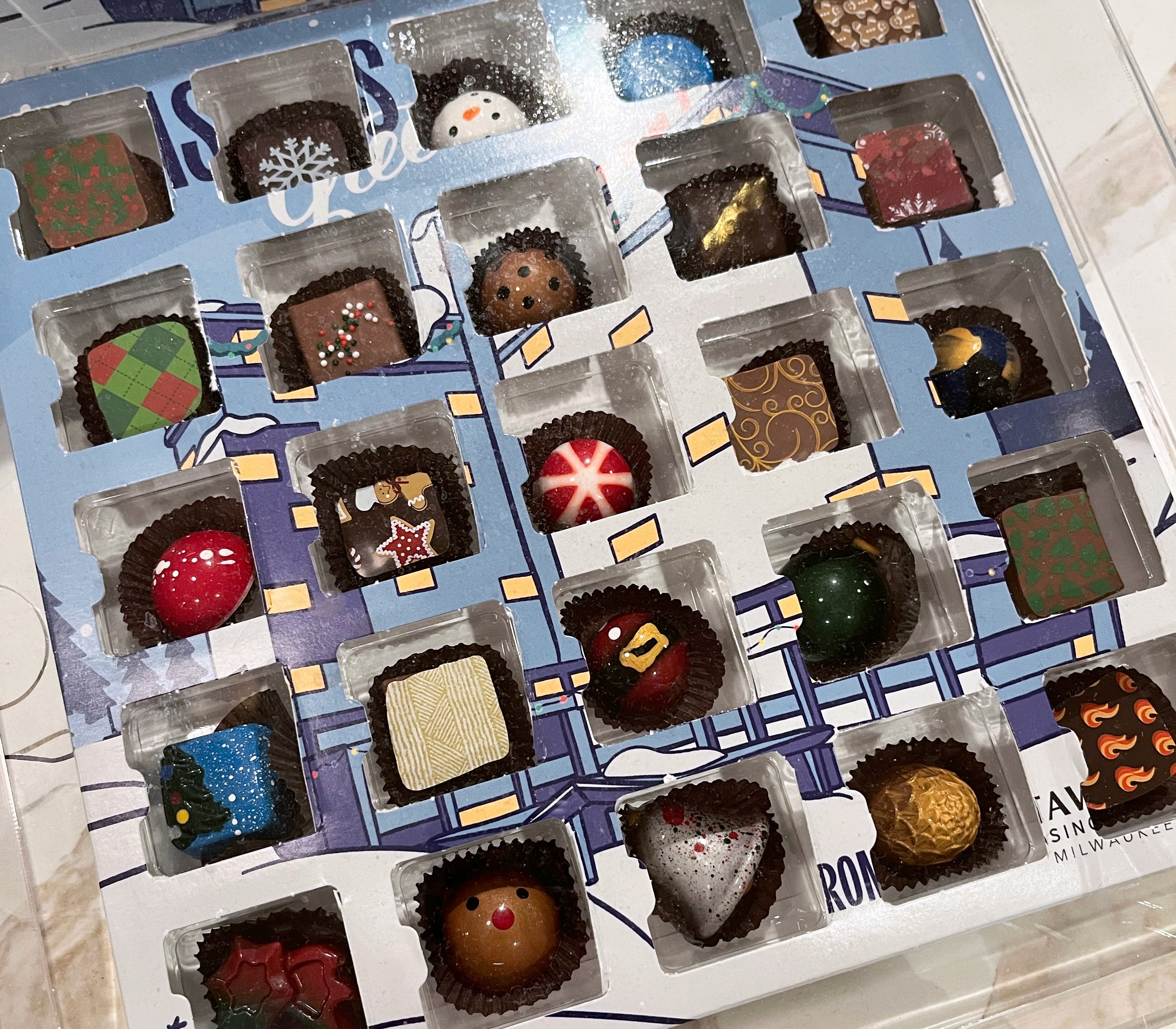 Close up of bon bons inside advent calendar