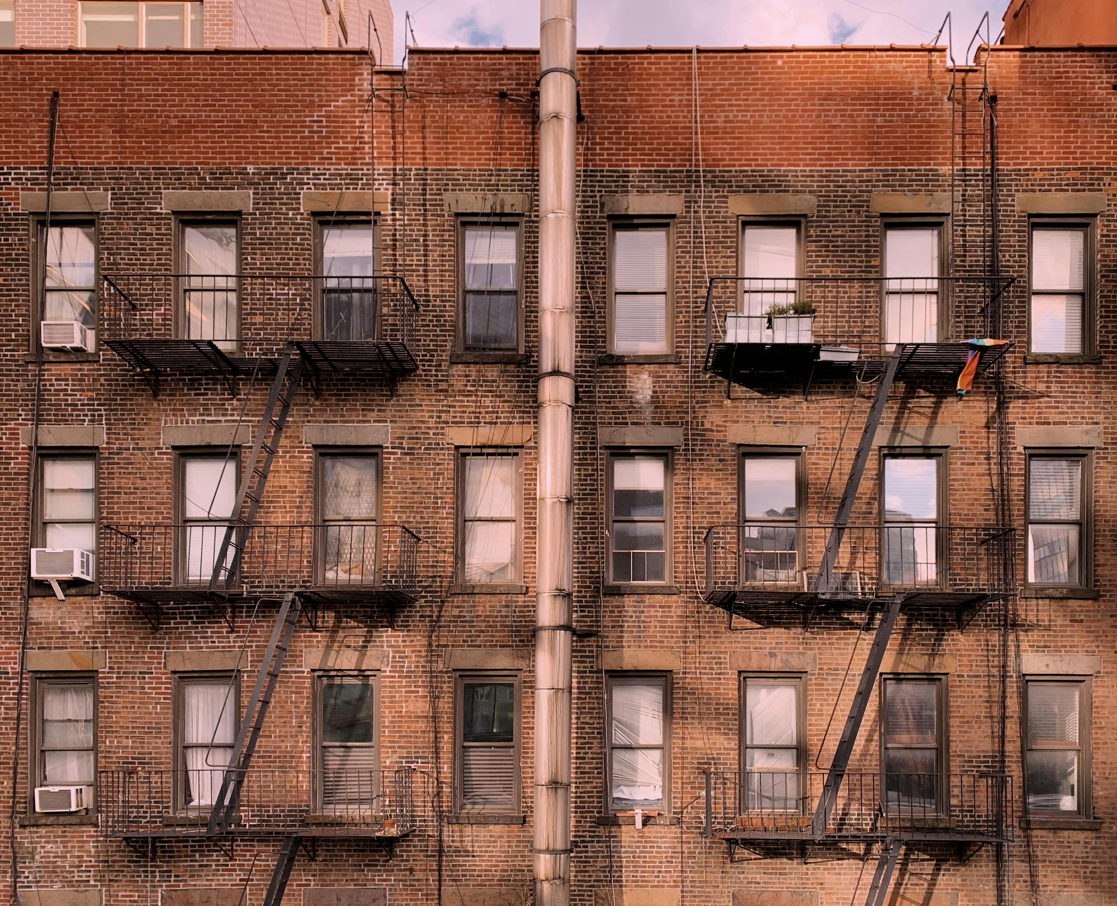 a tall brick building with lots of windows