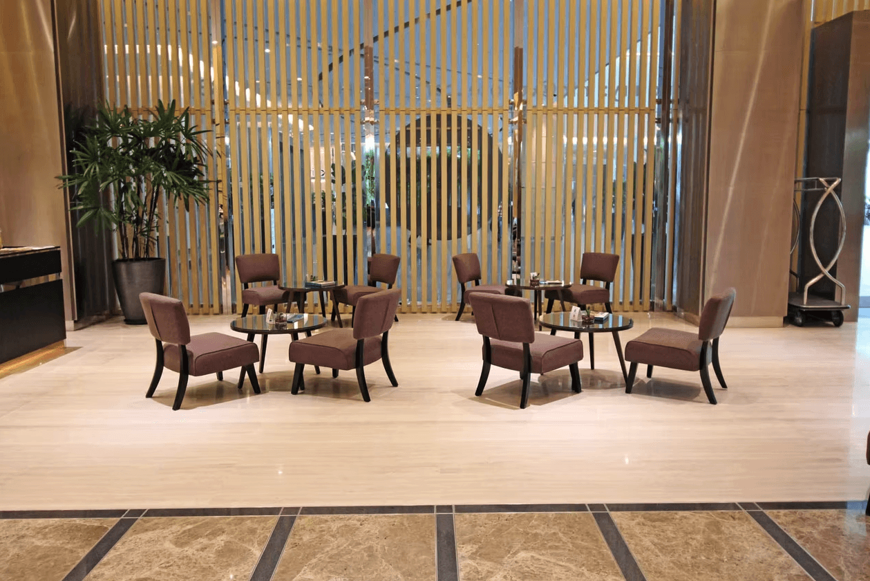 a room with a table, chairs, and a partition