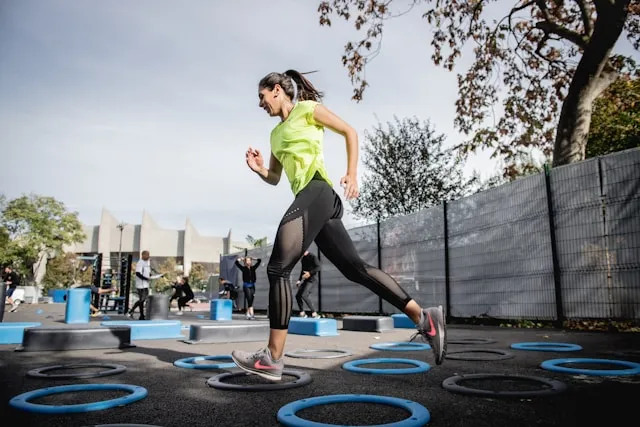 Woman running outdoors in bright sportswear