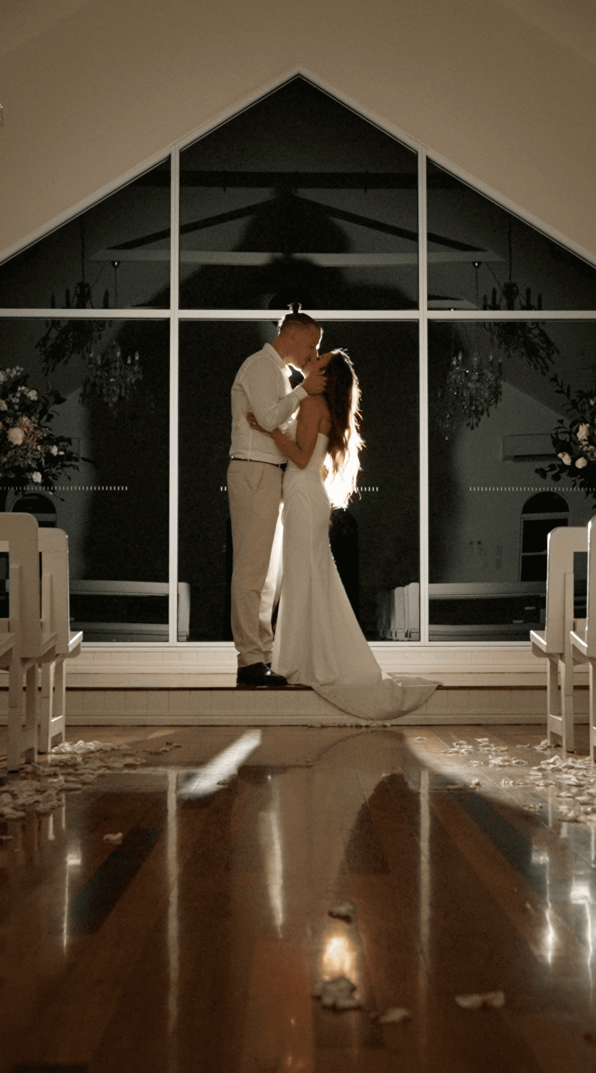 Olivia & Wayne sharing a beautiful quiet moment in the chapel at Tiffany's Maleny, shot by Creo Bella Luxury Wedding Films, Brisbane Wedding Filmmaker