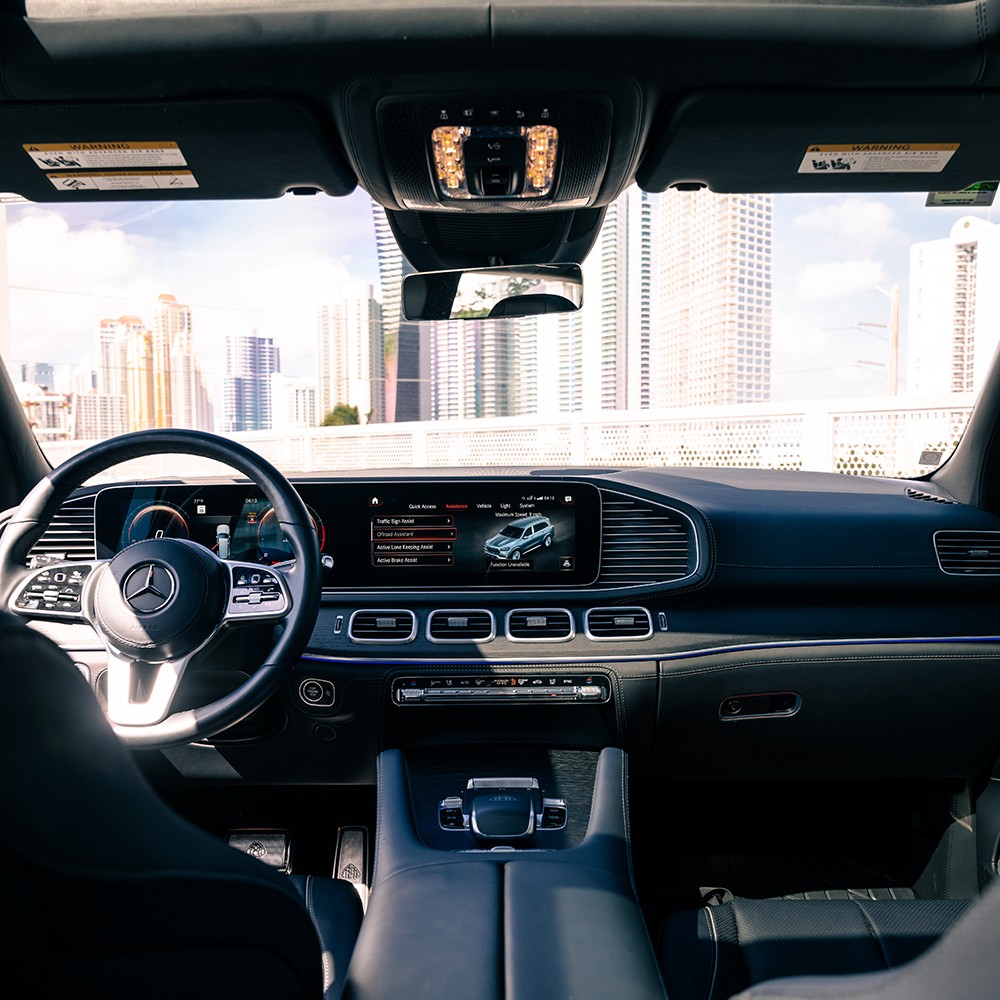 Driver's cockpit of the Mercedes-Maybach GLS 600, with digital displays, steering wheel, and ambient lighting.