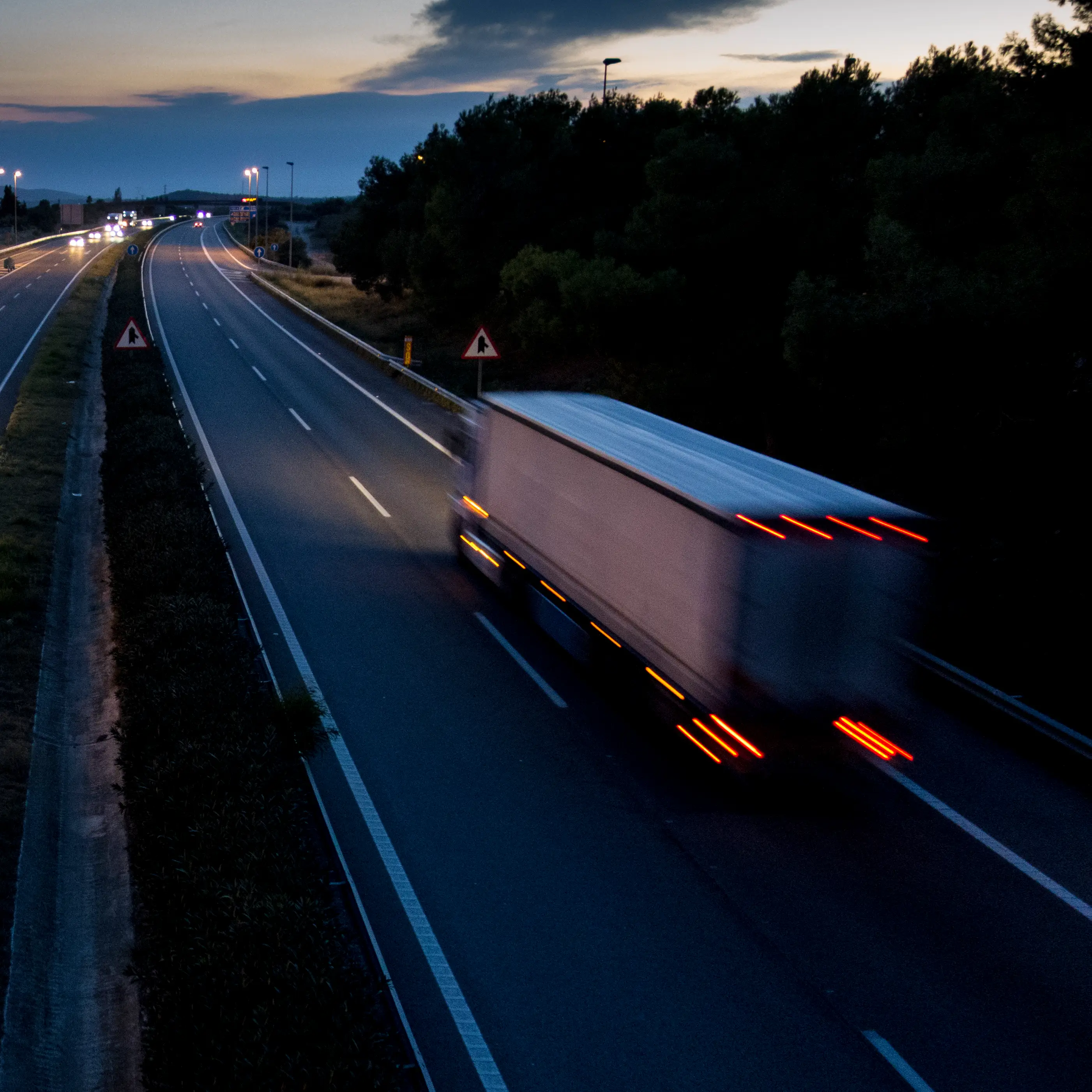 Truck on a highway at dusk