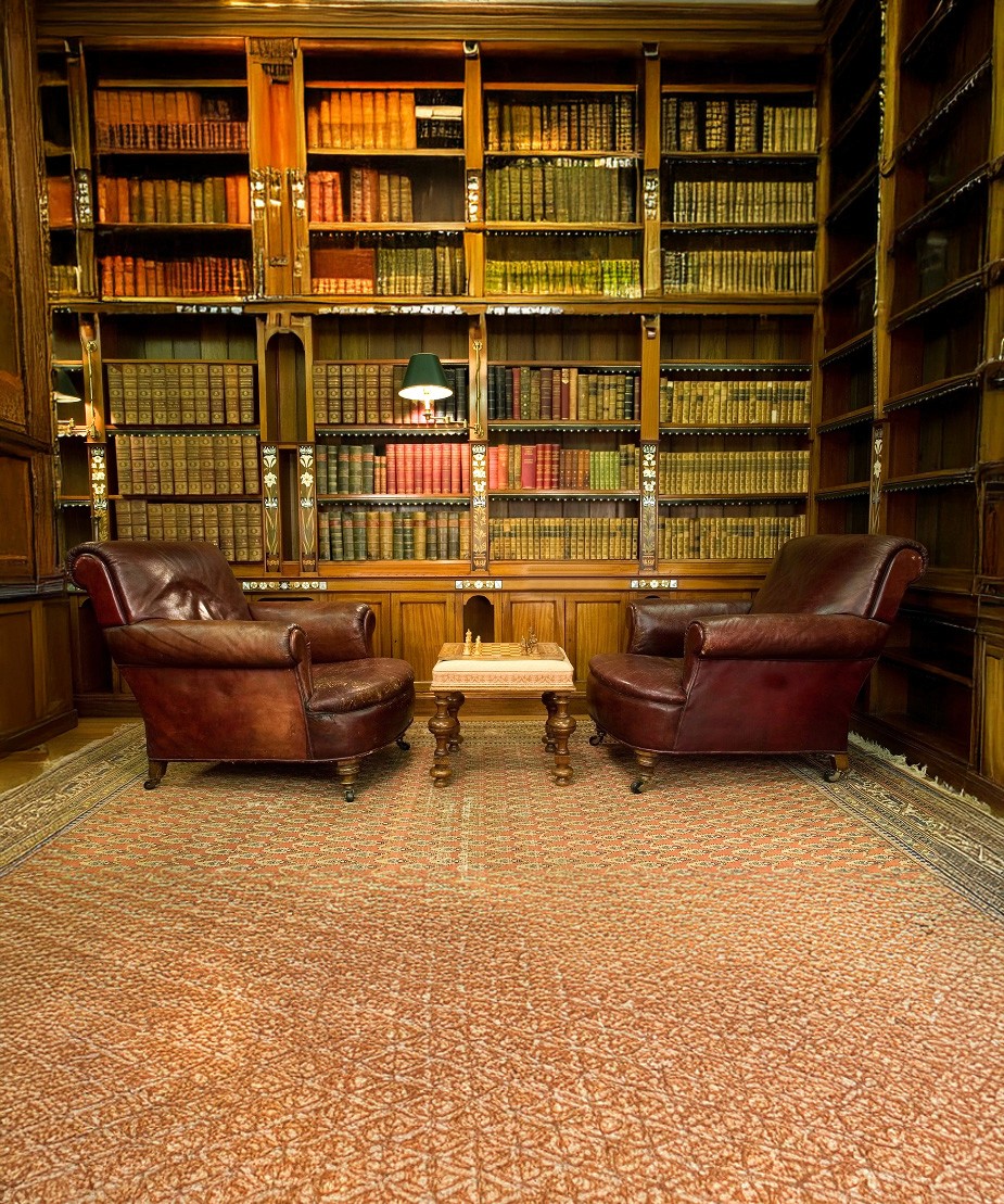 A private library setting with two leather chairs and a chess table, representing structured decision-making, governance oversight, and long-term planning within a Family Investment Company.