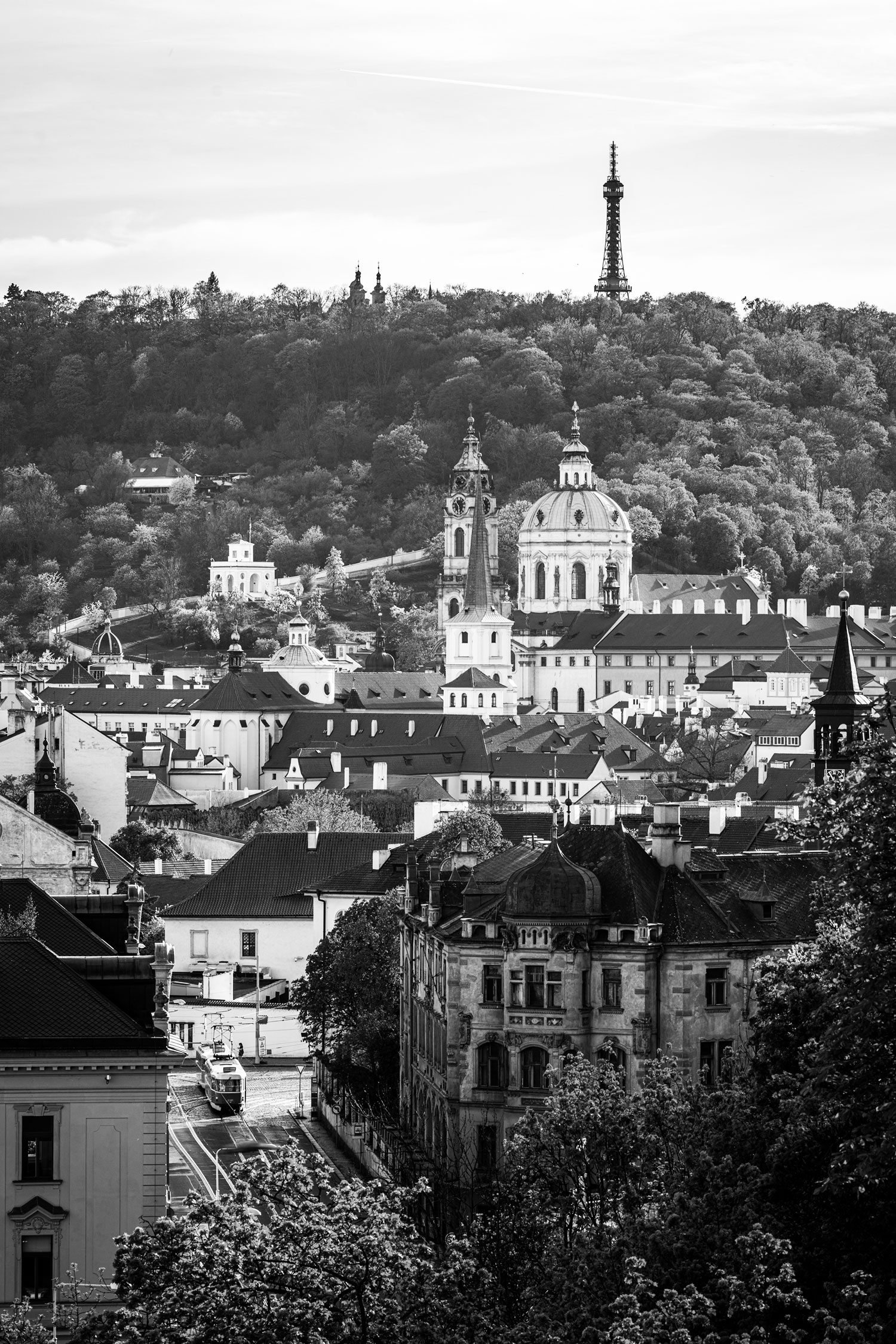 View of Prague city with historic buildings and surrounding landscape.