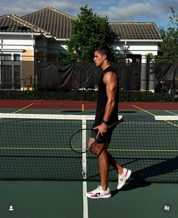 Dynamic close-up of a runner’s foot mid-stride on a muddy forest trail, wearing black socks and red trail shoes with visible sole pattern.