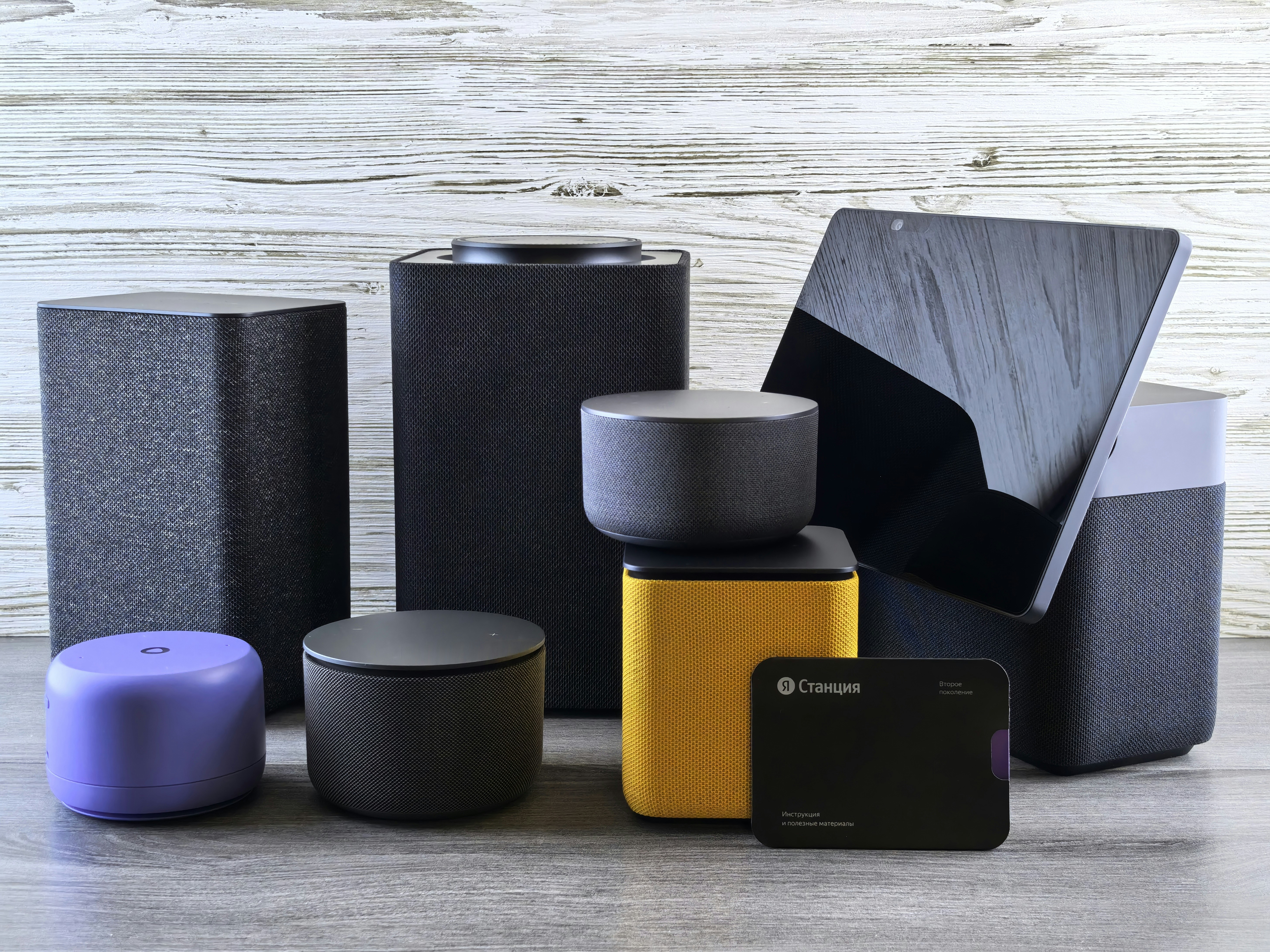 Collection of modern electronic devices and speakers.