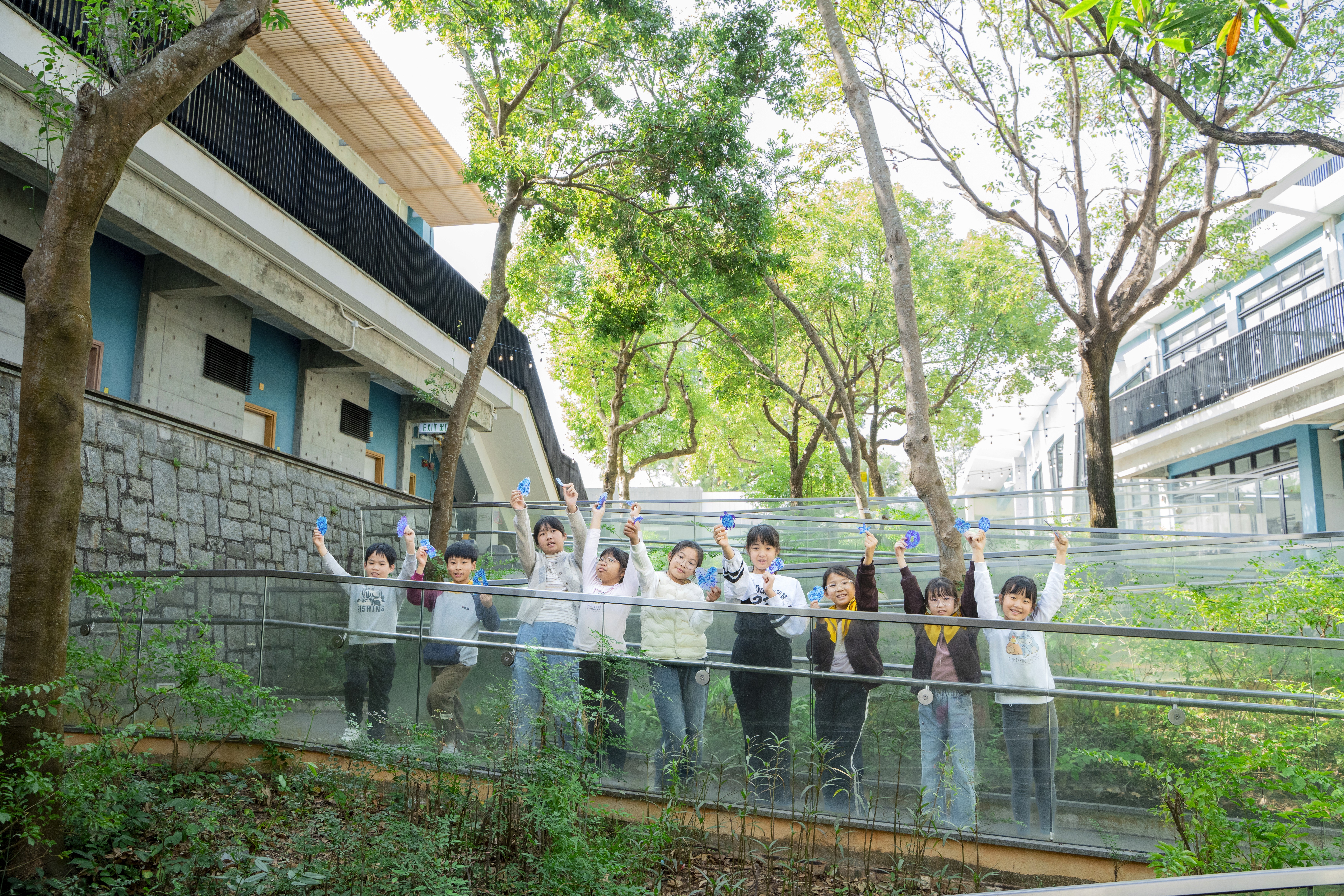 woman holding a phone and man looking at the phone. both are smiling