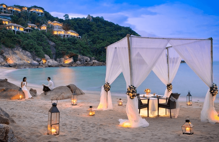 Couples walking on the beach