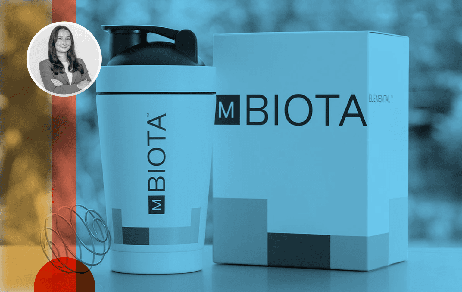 Two professionals collaborate at a desk, discussing a project displayed on a computer screen in a modern office setting.