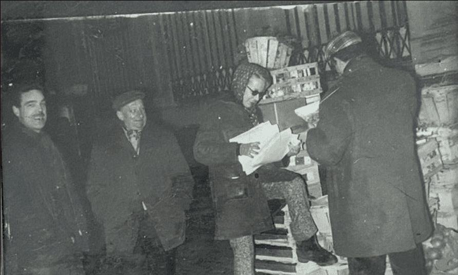 Group of men standing with Sufboard