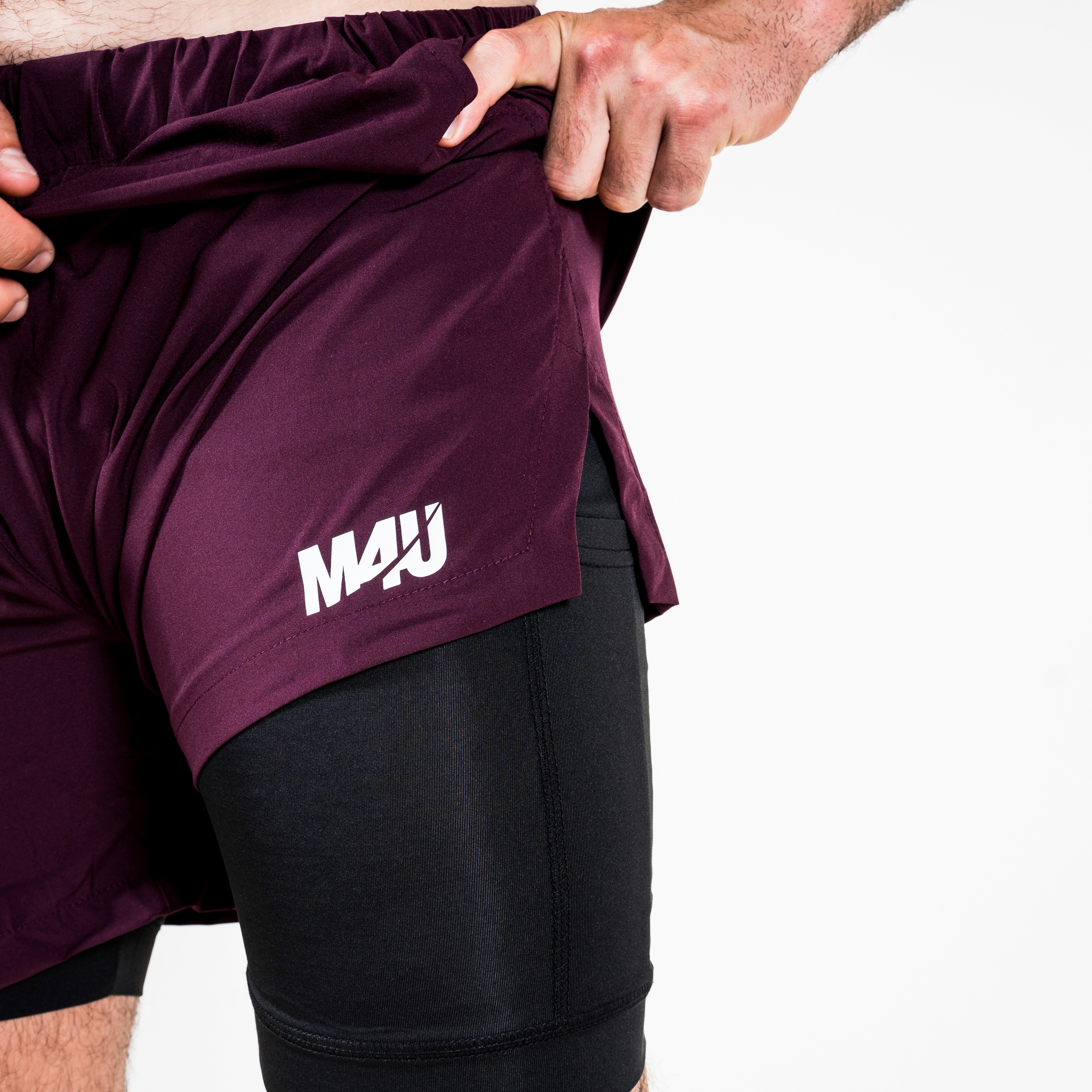  A woman with her eyes closed, wearing a helmet, appears to be in a moment of concentration or relaxation.