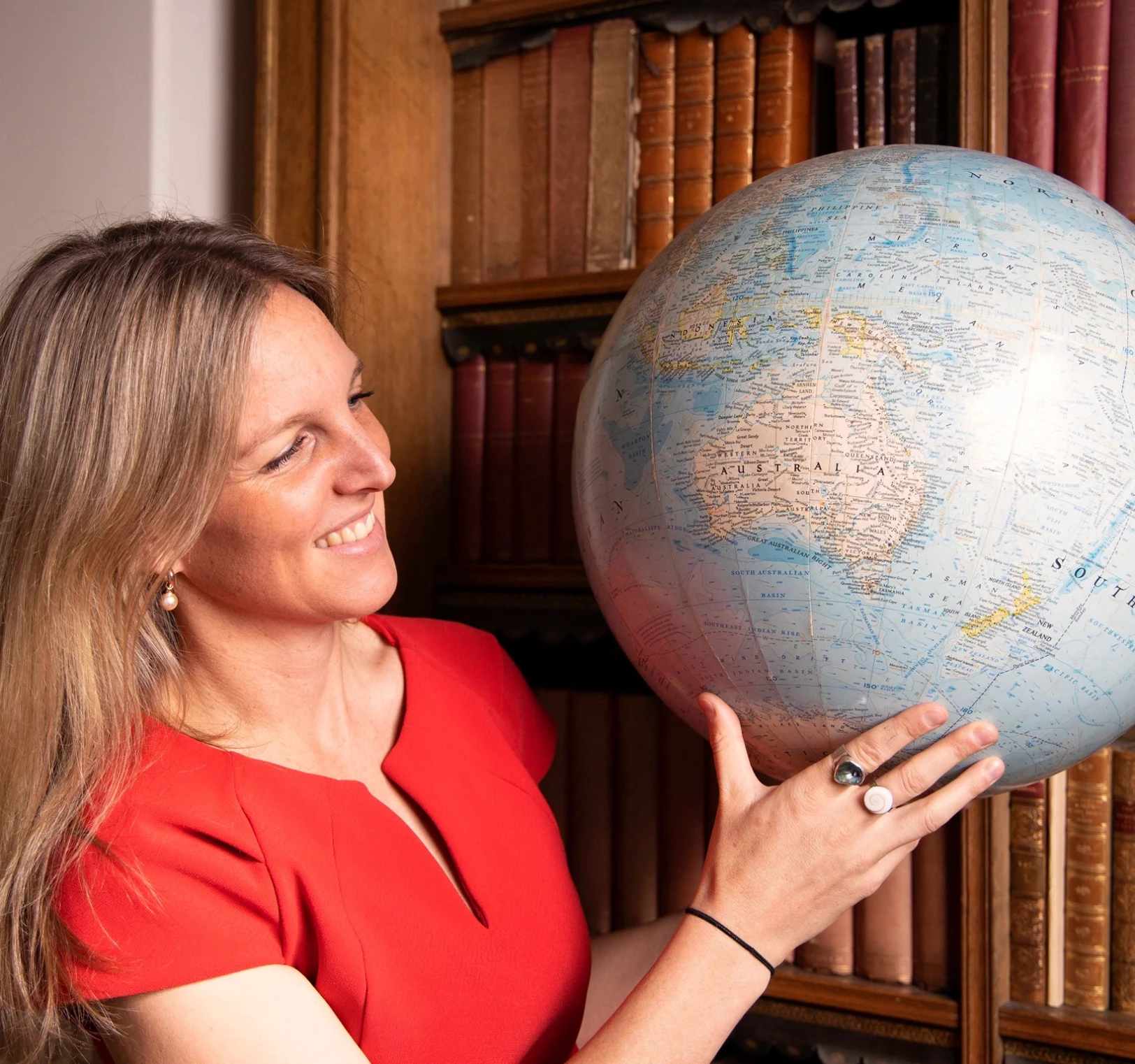 person in white long sleeve shirt holding white book