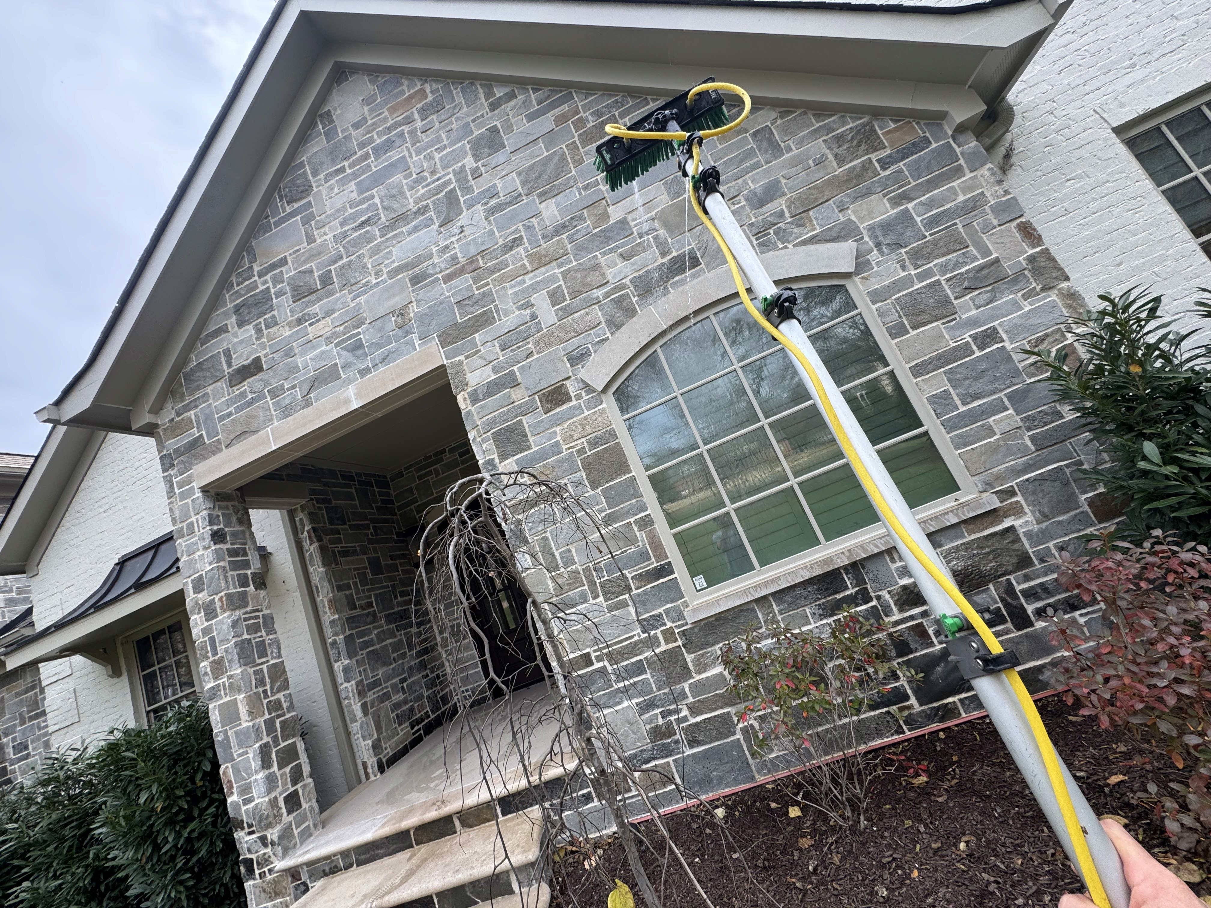 A Nashville home with windows being cleaned