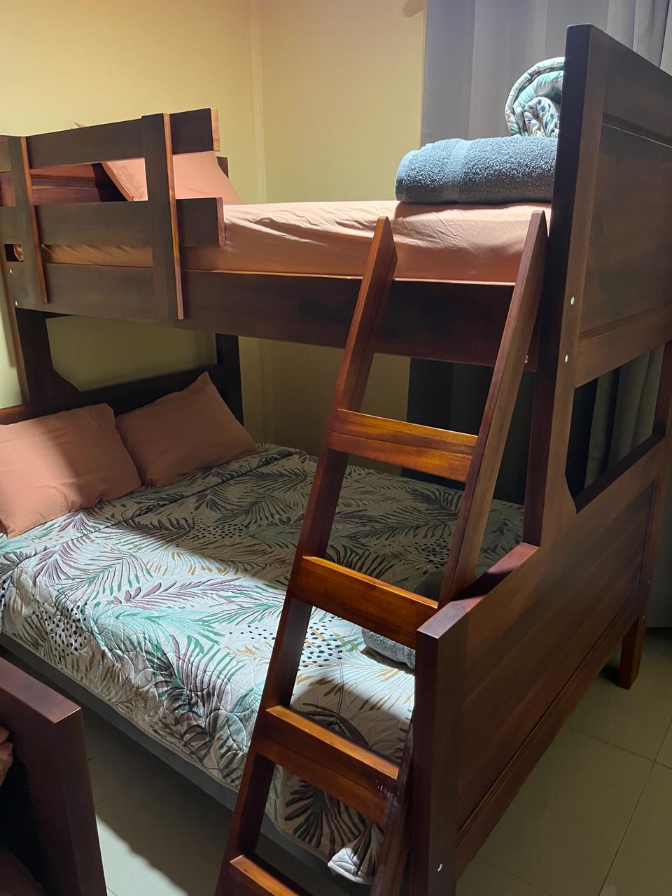 an aerial view of a beach surrounded by trees
