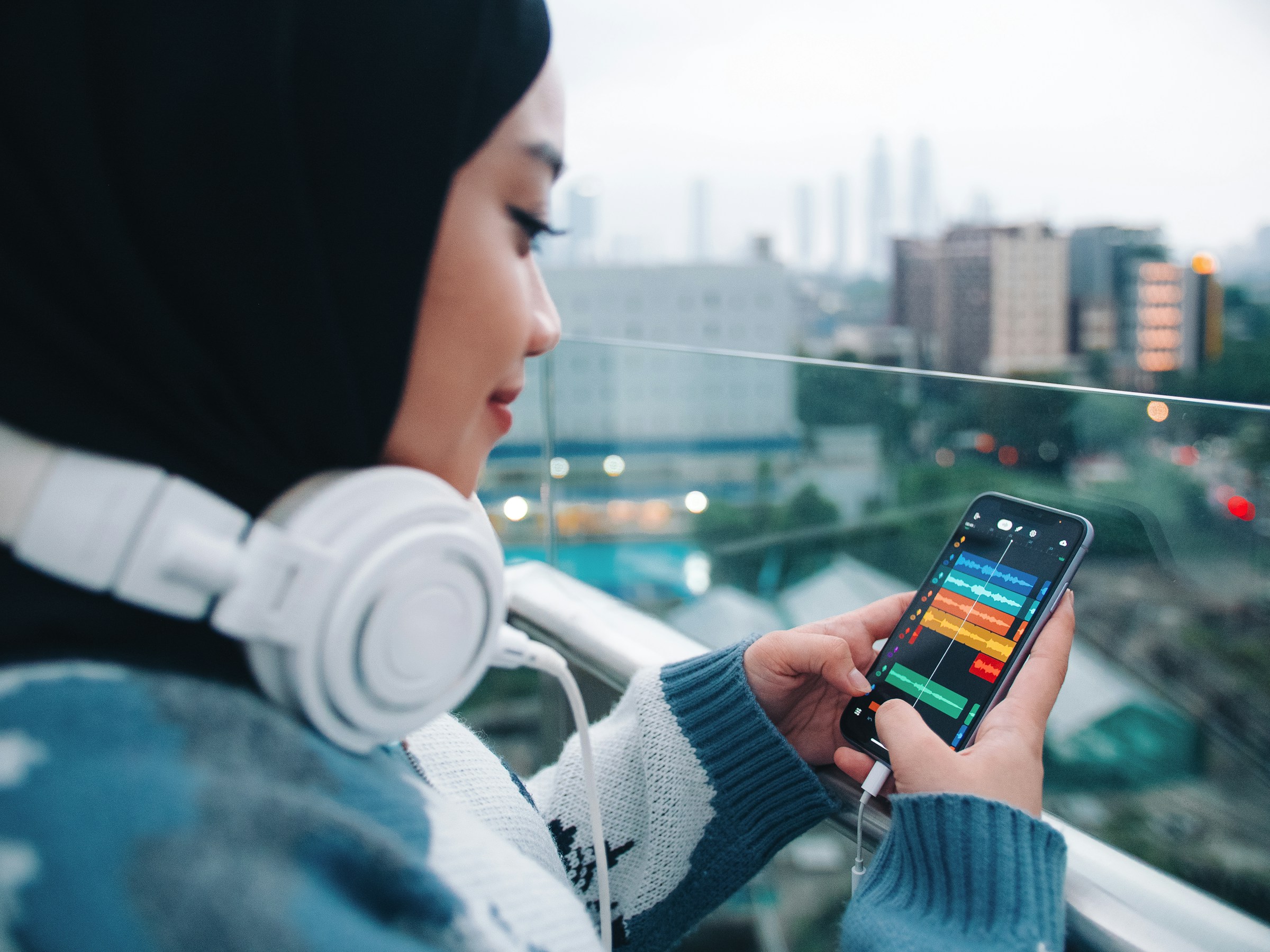 woman listening to songs - Best Headphones for Recording Music