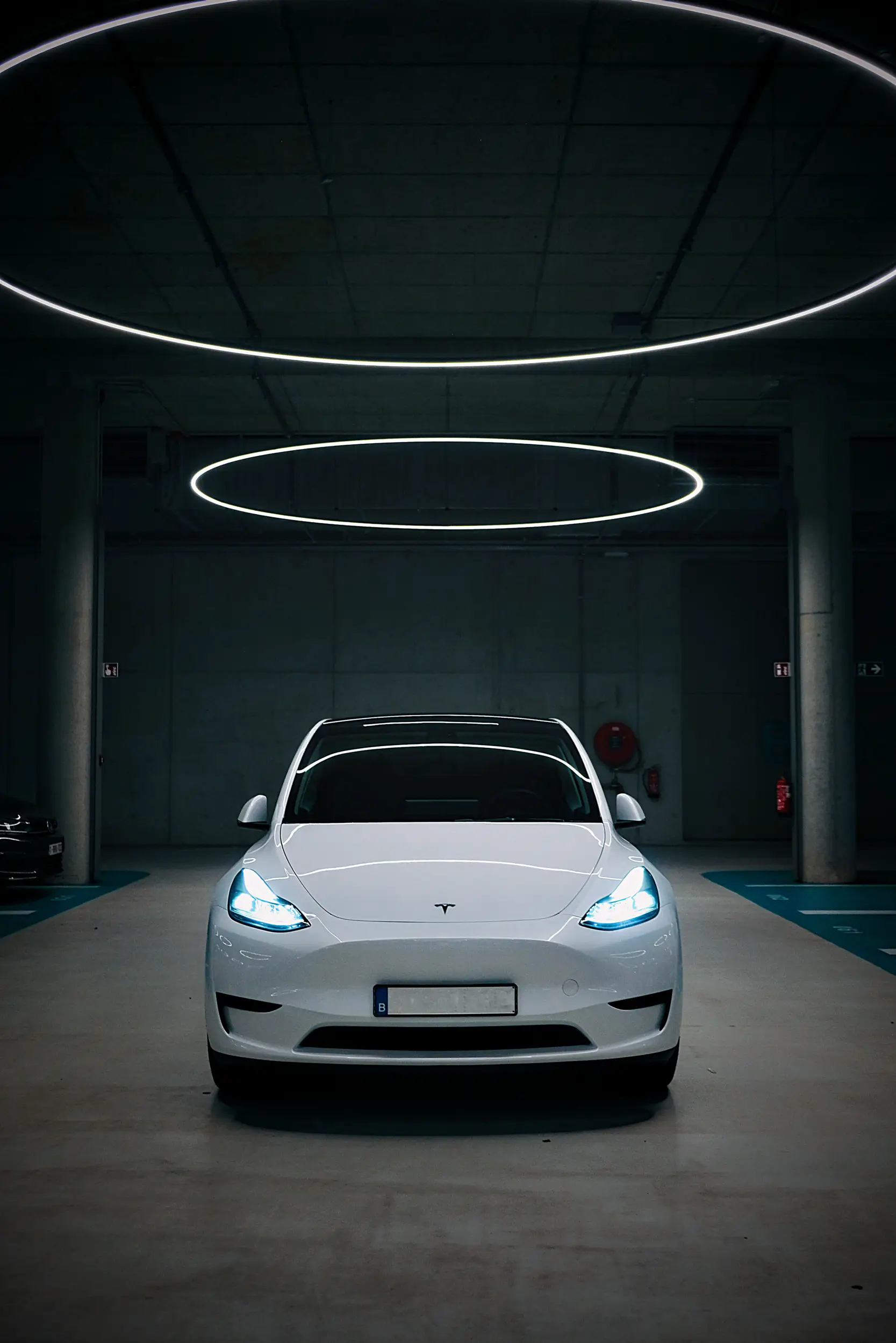 Automotive photography for Tesla magazines and social media. Tesla Model Y in an underground parking garage.