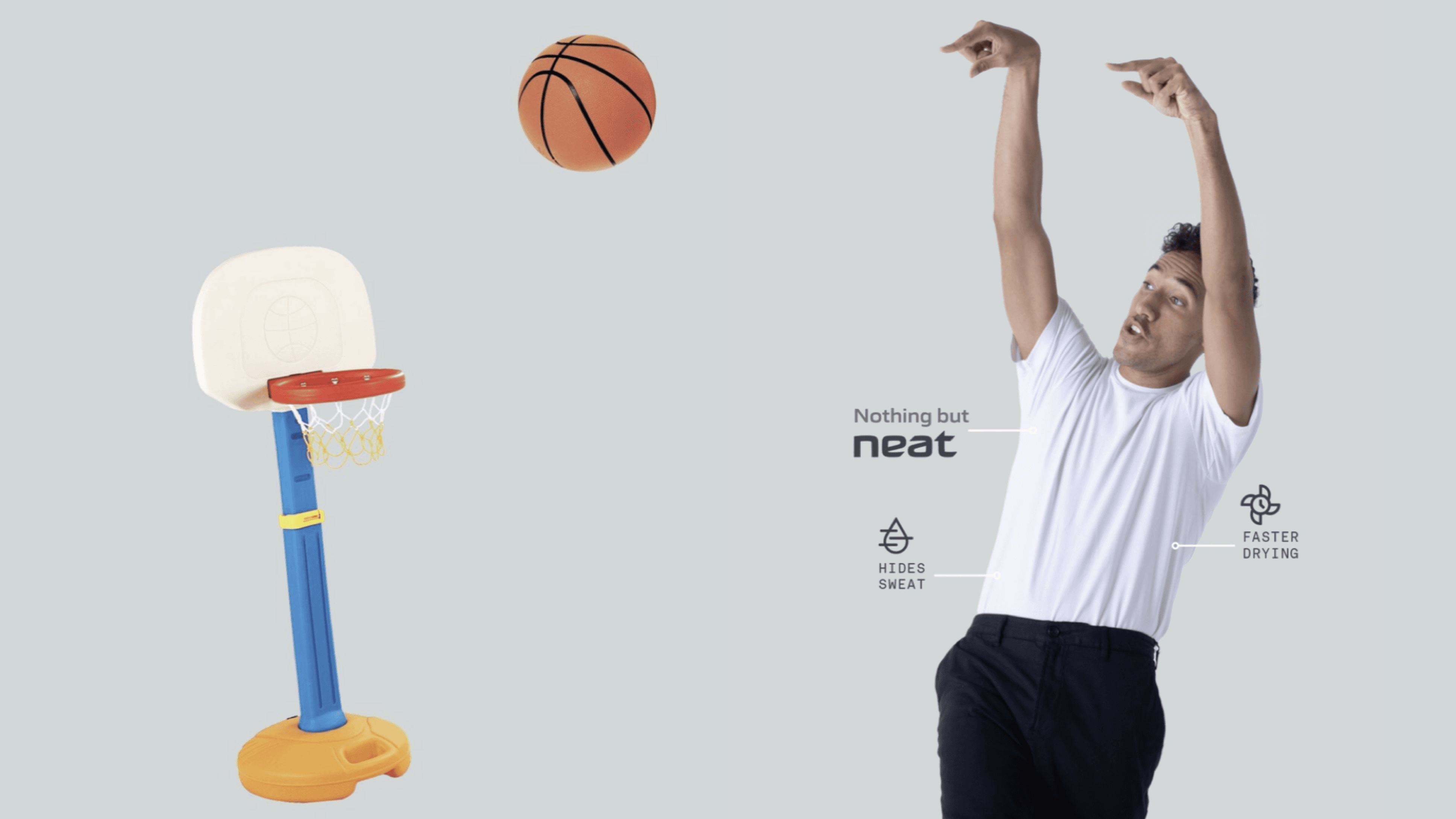 Modern home office setup with a monitor, ergonomic chair, keyboard, and indoor plants near a window with blinds.