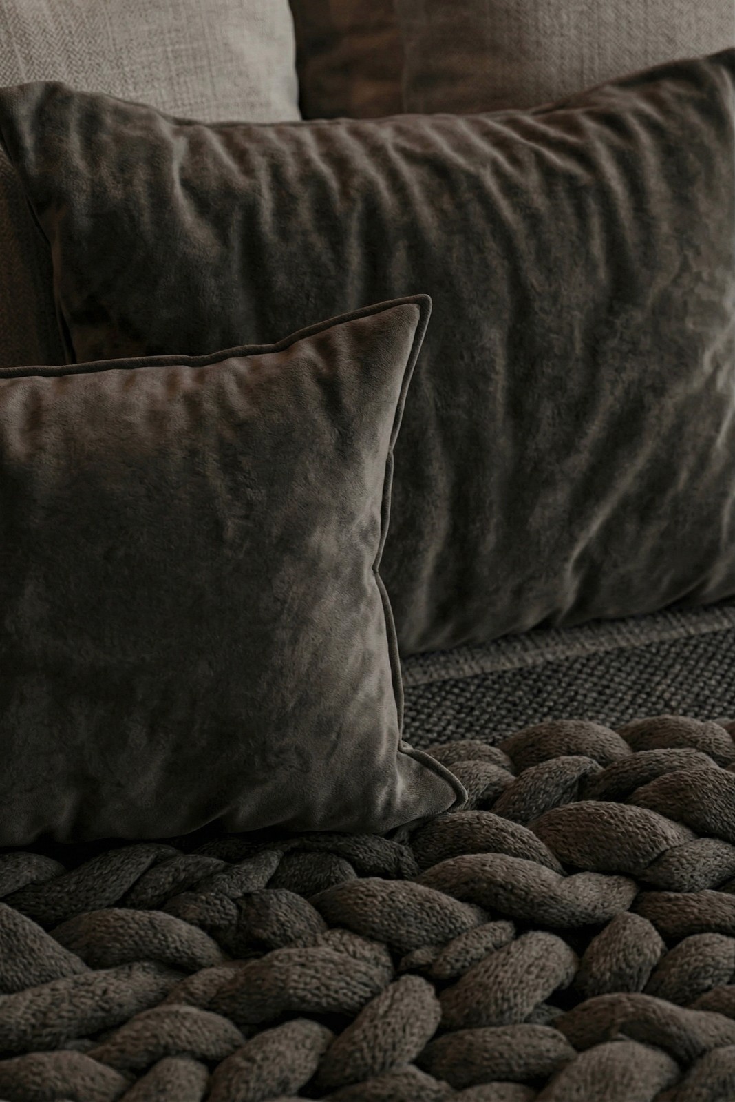 Vintage-modern living room with tufted sofas, false ceiling, and layered warm lighting.