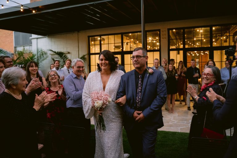 Bride being walked down the aisle by her father