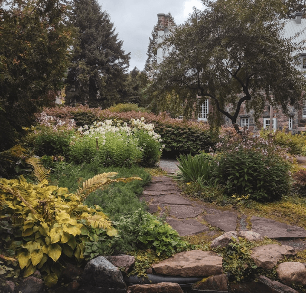 Outdoor flower graden with stone trail leading through