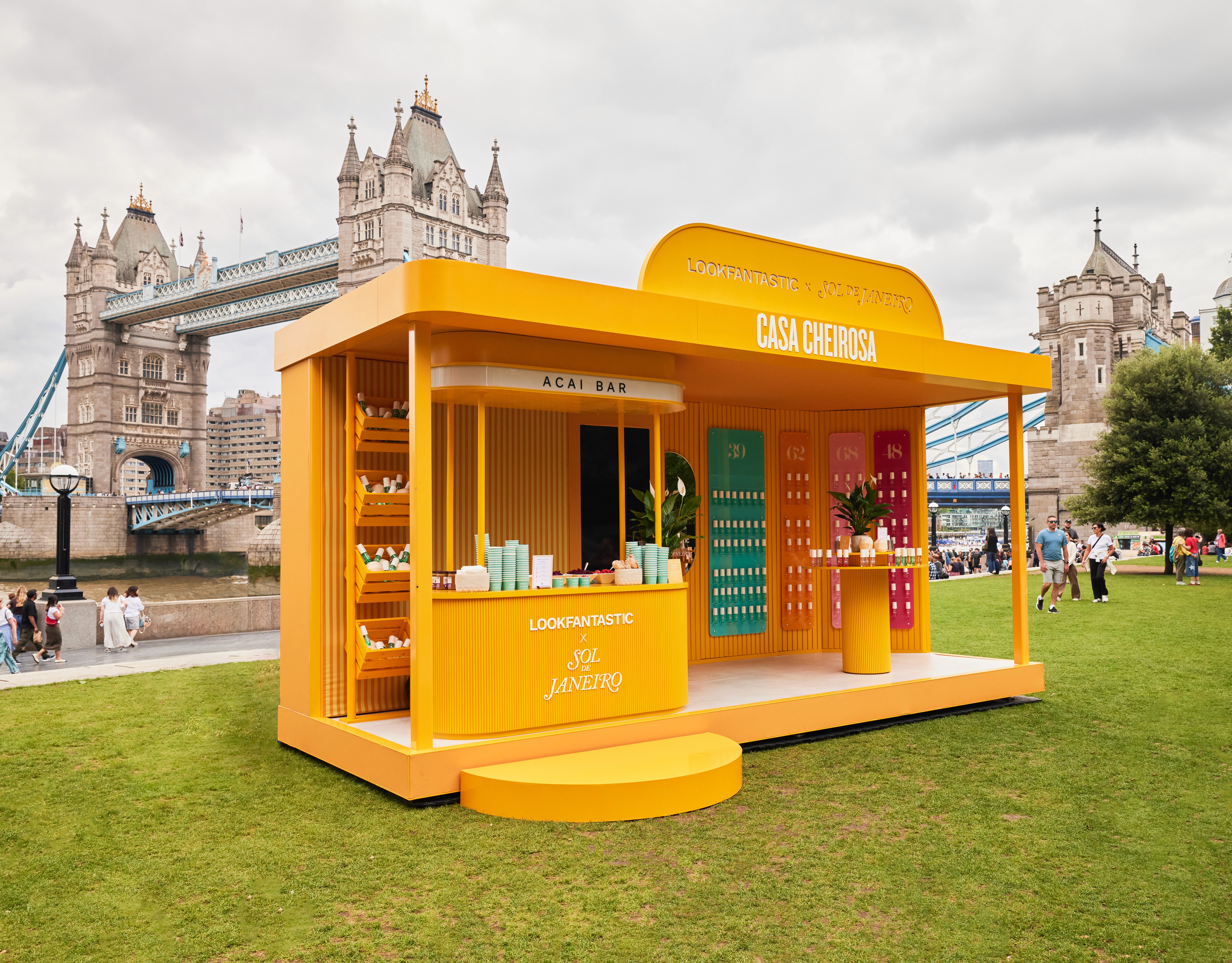 Yellow Casa Cheirosa brand activation pop-up kiosk by Tower Bridge, London, built by EXOVA Events