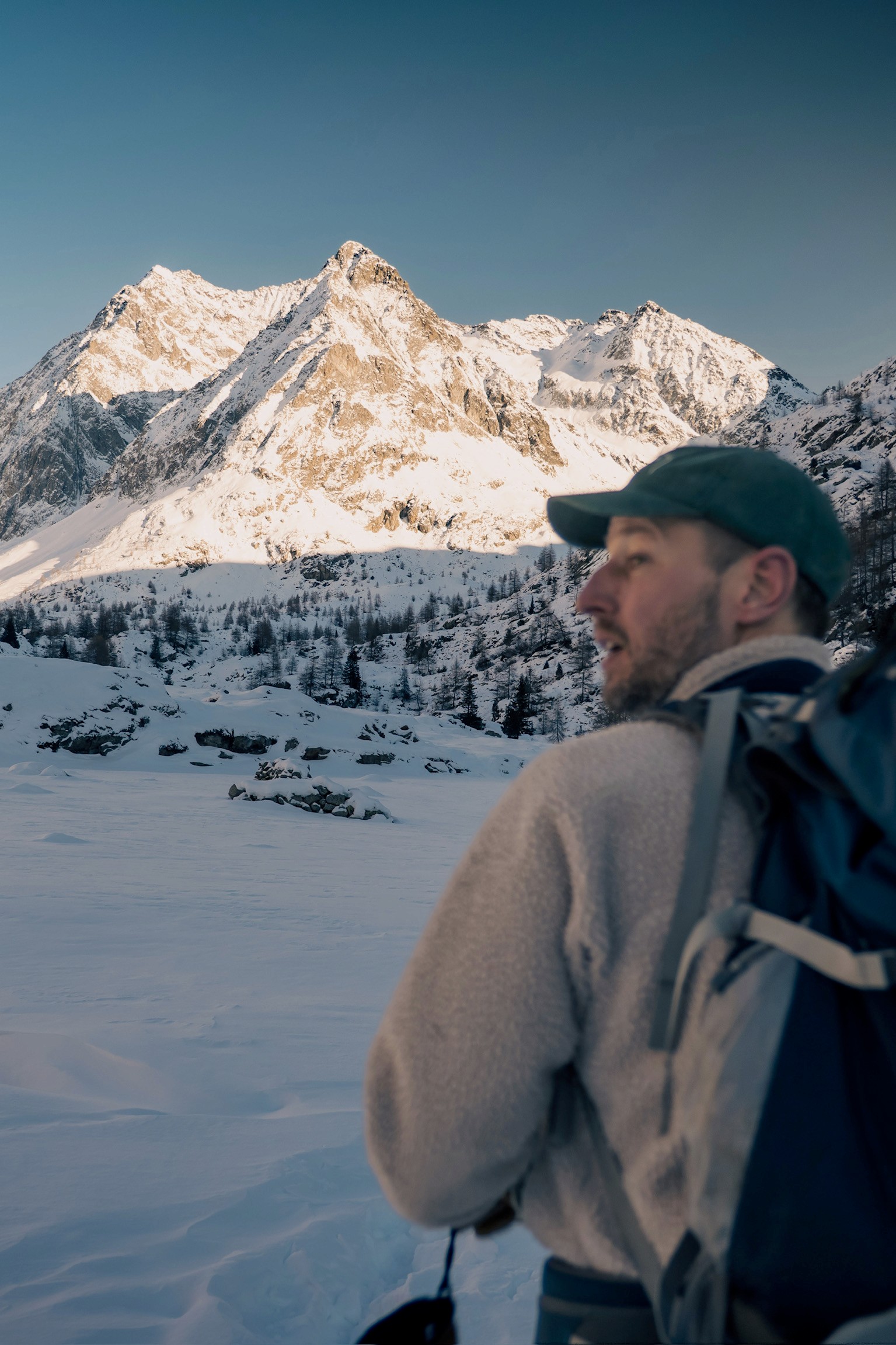 Two hikers in a snow packed landscape