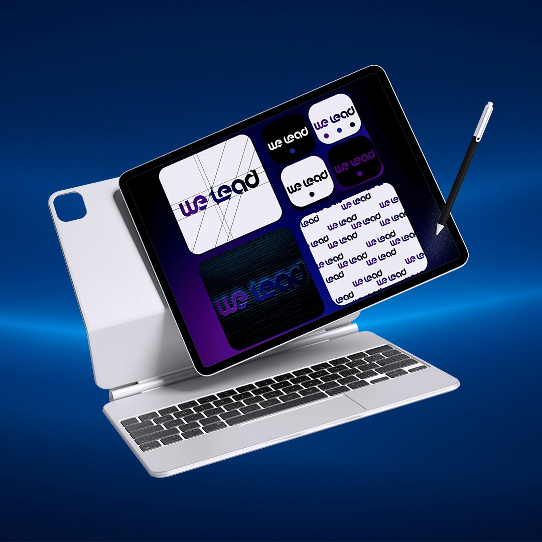 3D mockup of a graphic tablet displaying multiple logo design concepts for We Lead Agency, representing graphic design services.