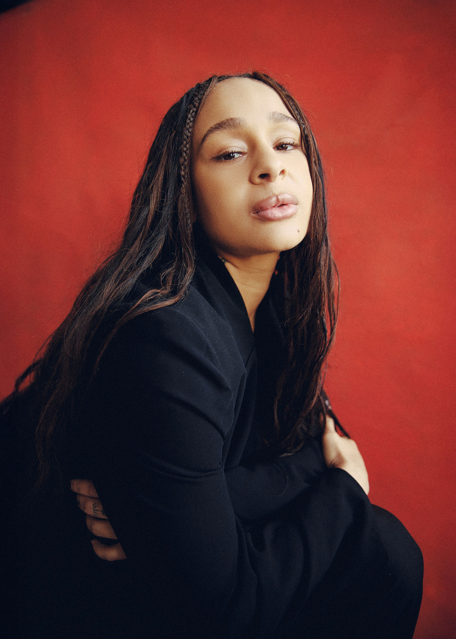 A tall waterfall cascades into a turquoise pool below.