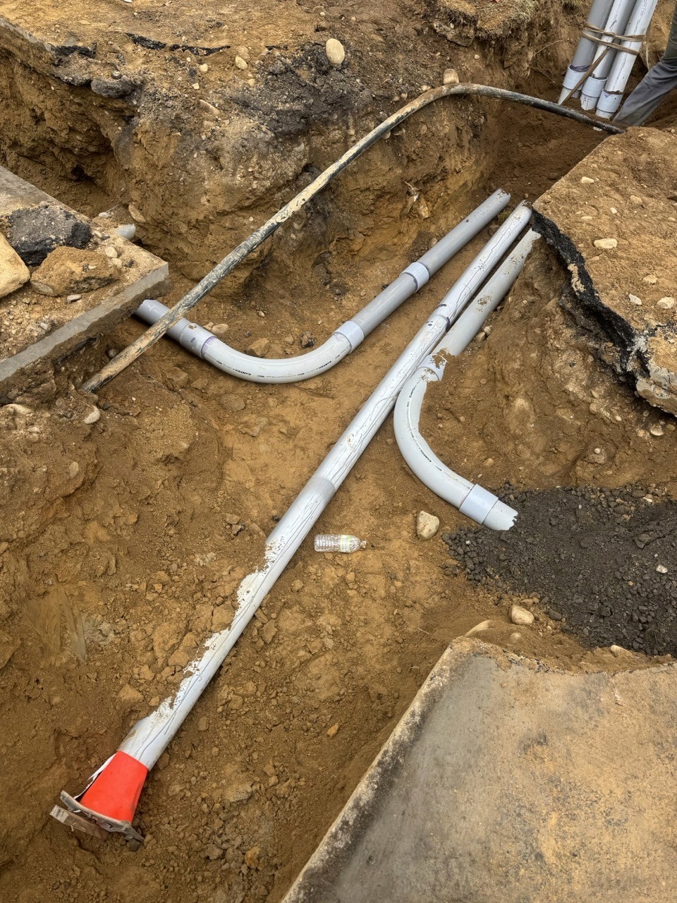 New water service pipes bedded in a sand trench