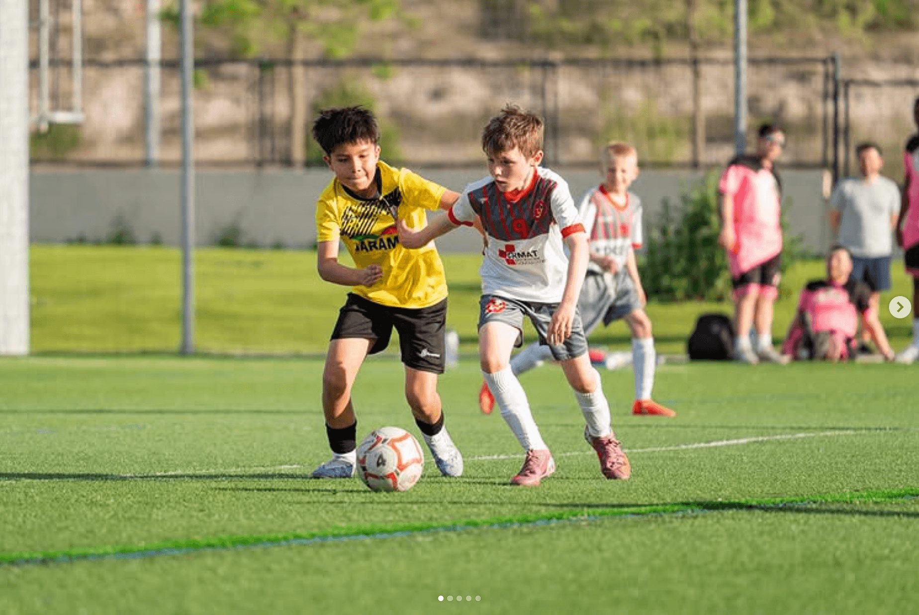 Edge FA player in the white and grey home kit during a match