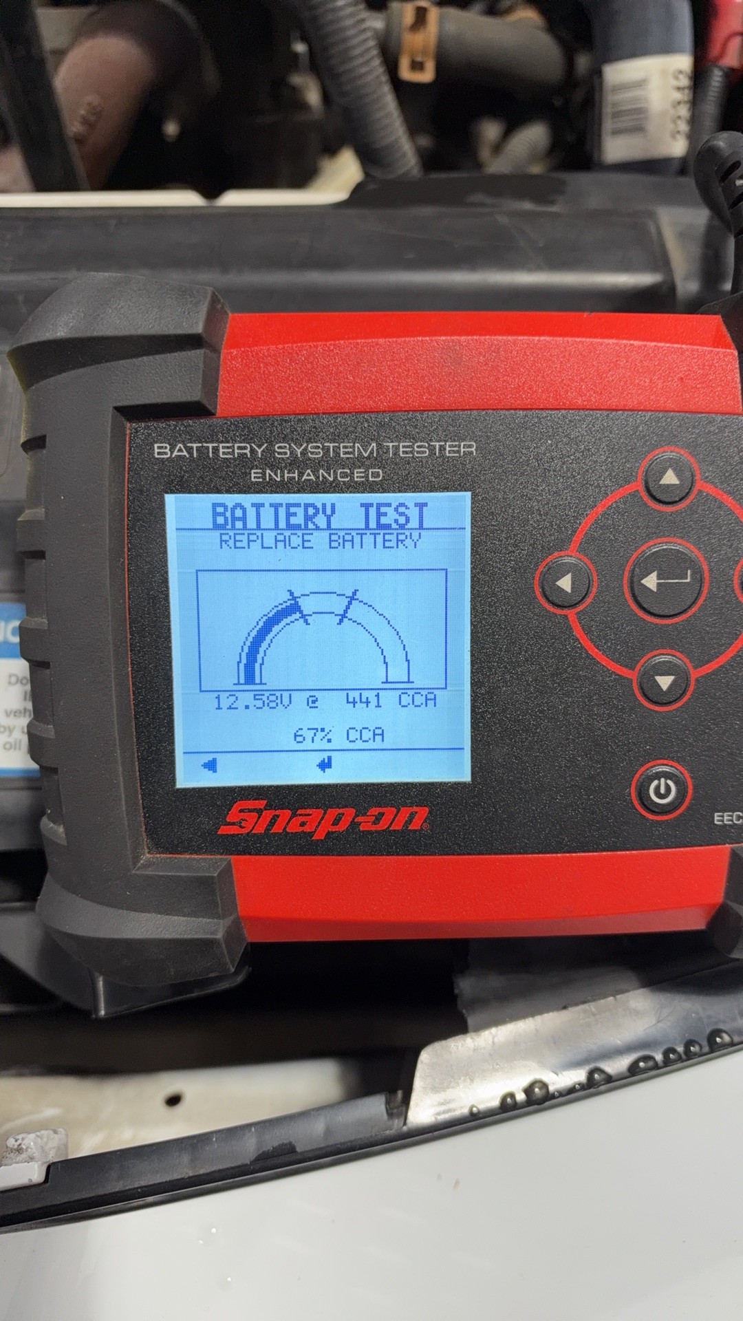 Snap-on battery tester on the Pontiac Sunfire showing REPLACE BATTERY at 67 percent of rated cold cranking amps