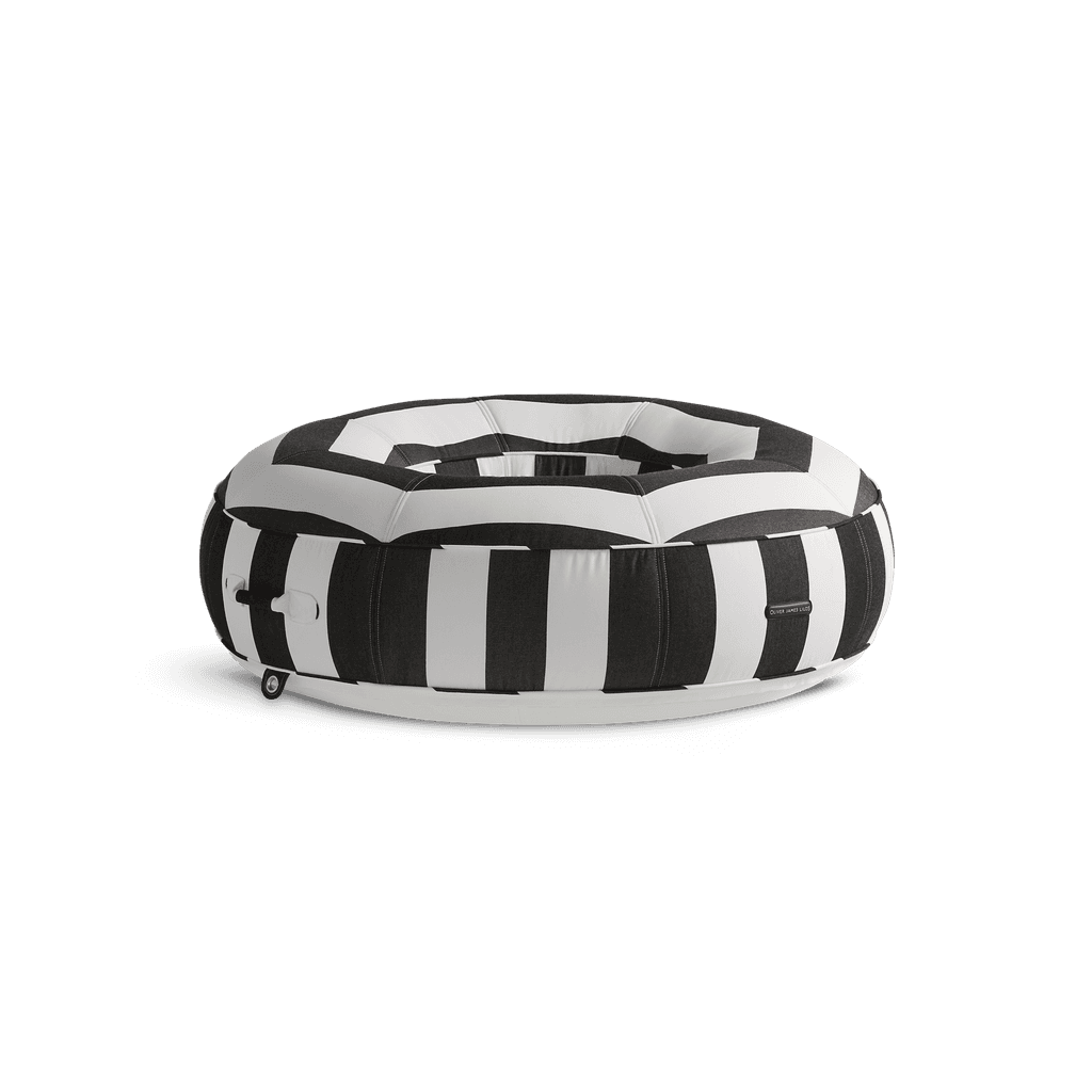 Ring-shaped luxury pool float in black-and-white stripe canvas with quilted panels and matte white base