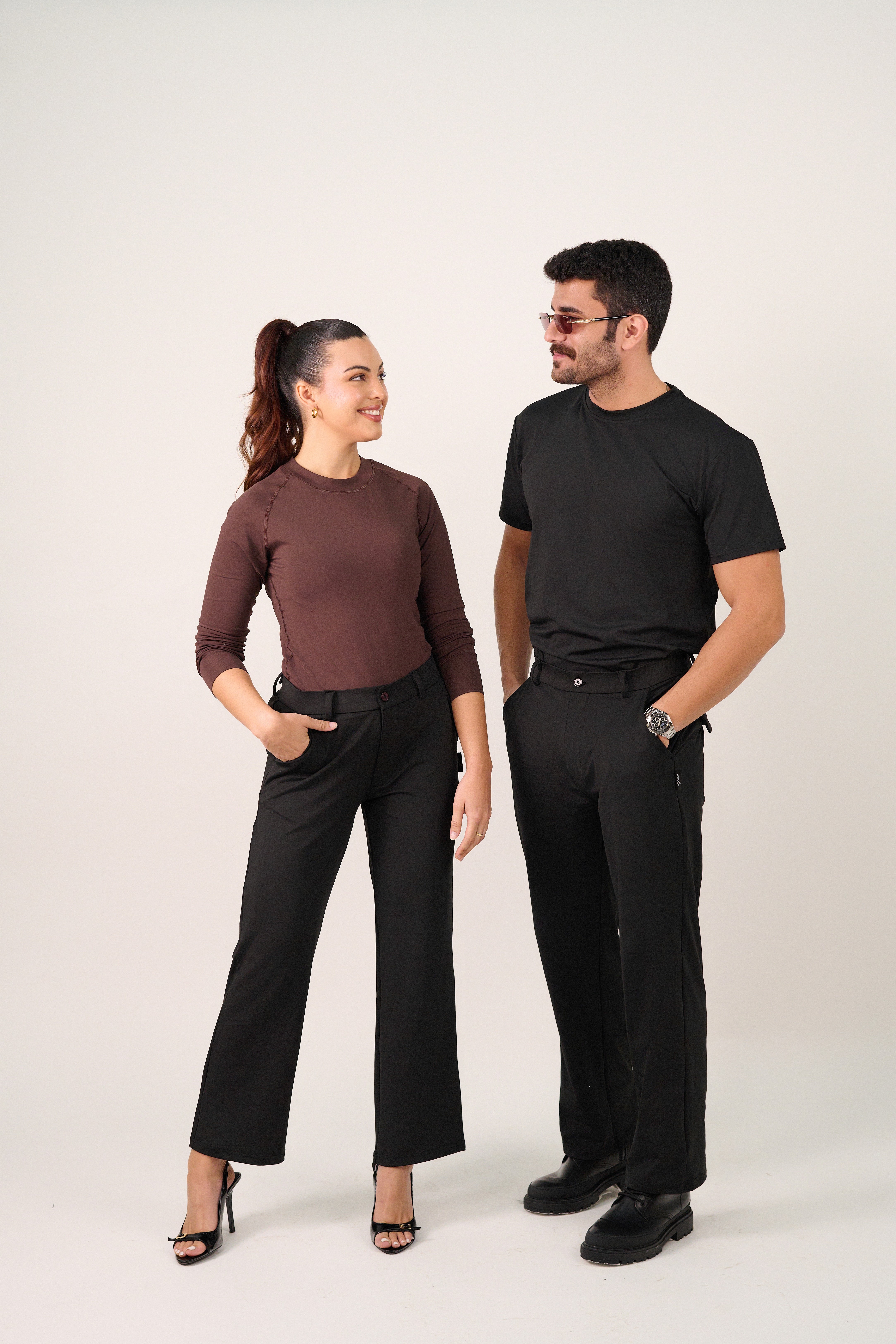 Friends laughing and posing inside a car