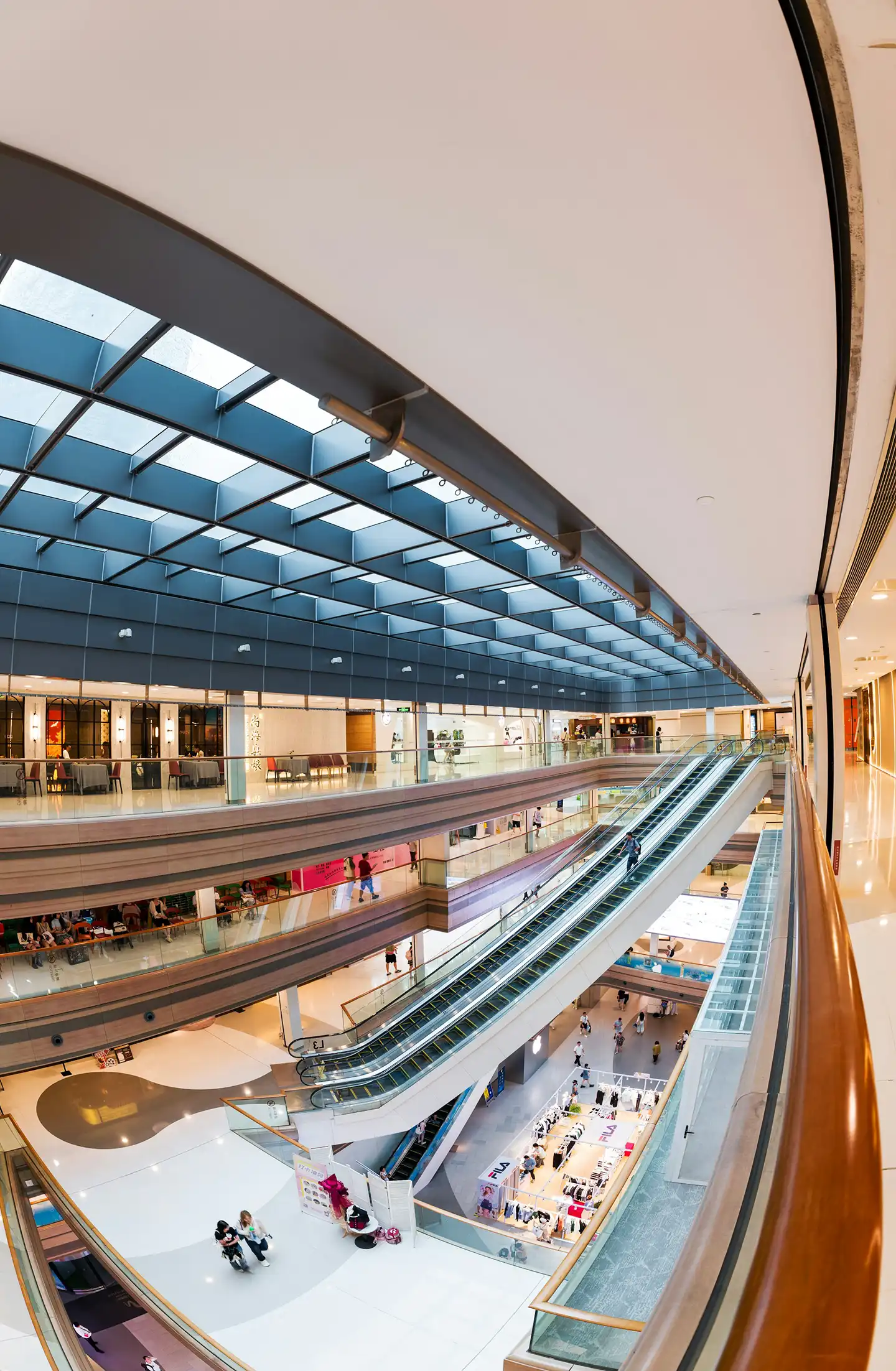 Public area in Dubai with walkways, shops, and modern structures