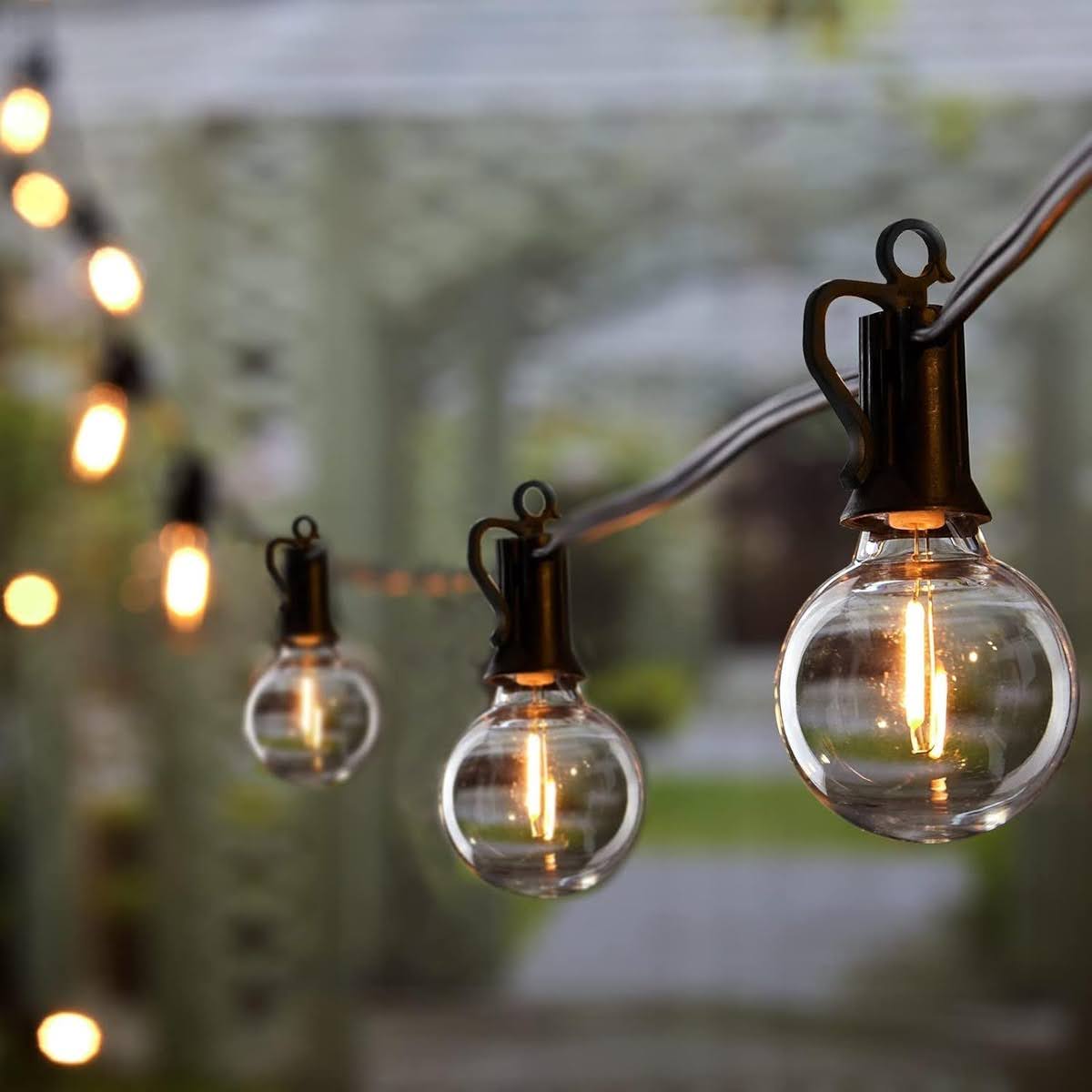 Rustic outdoor string lights hanging from a patio.