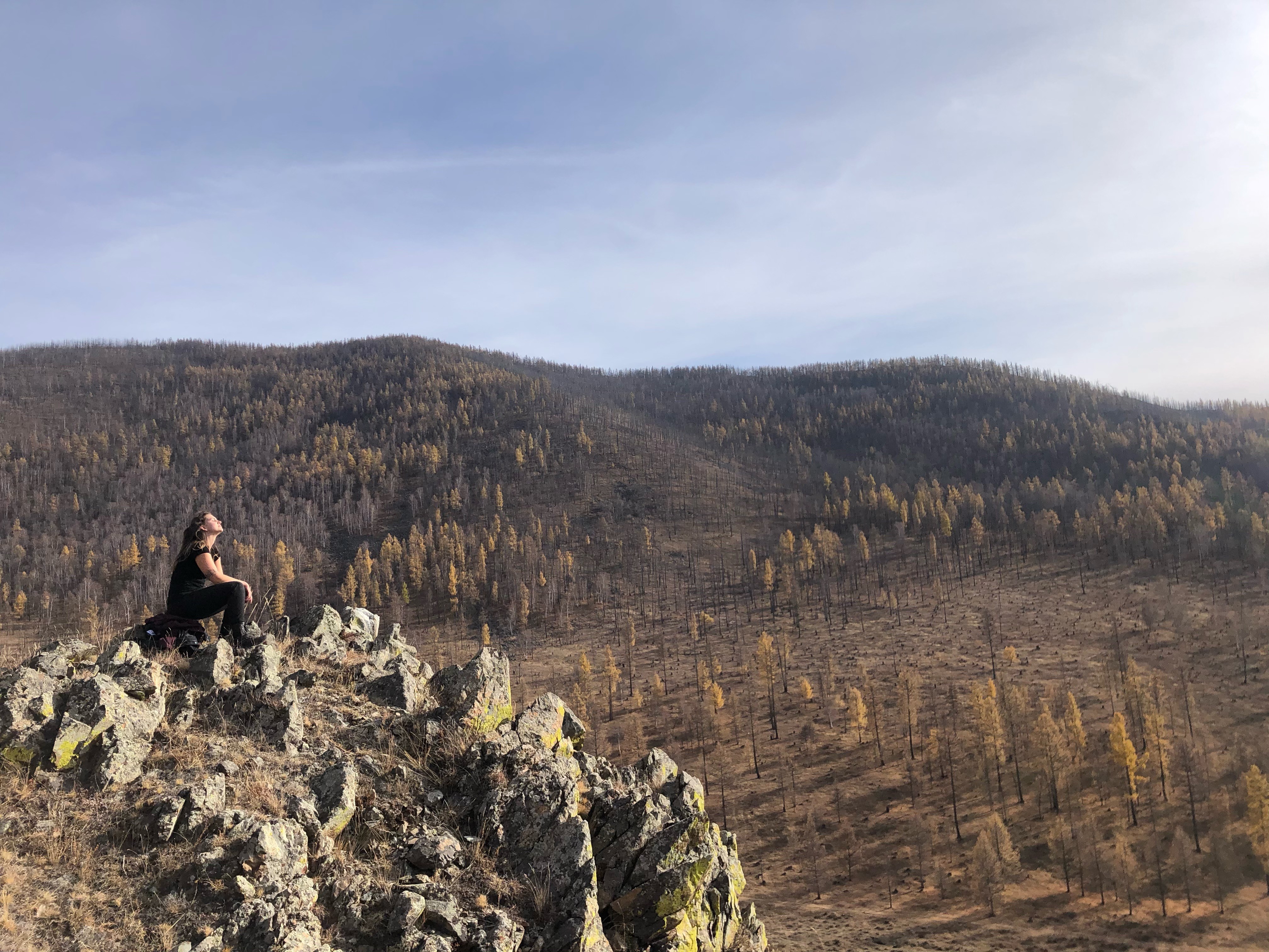 a blurry photo of a person standing in front of a wall