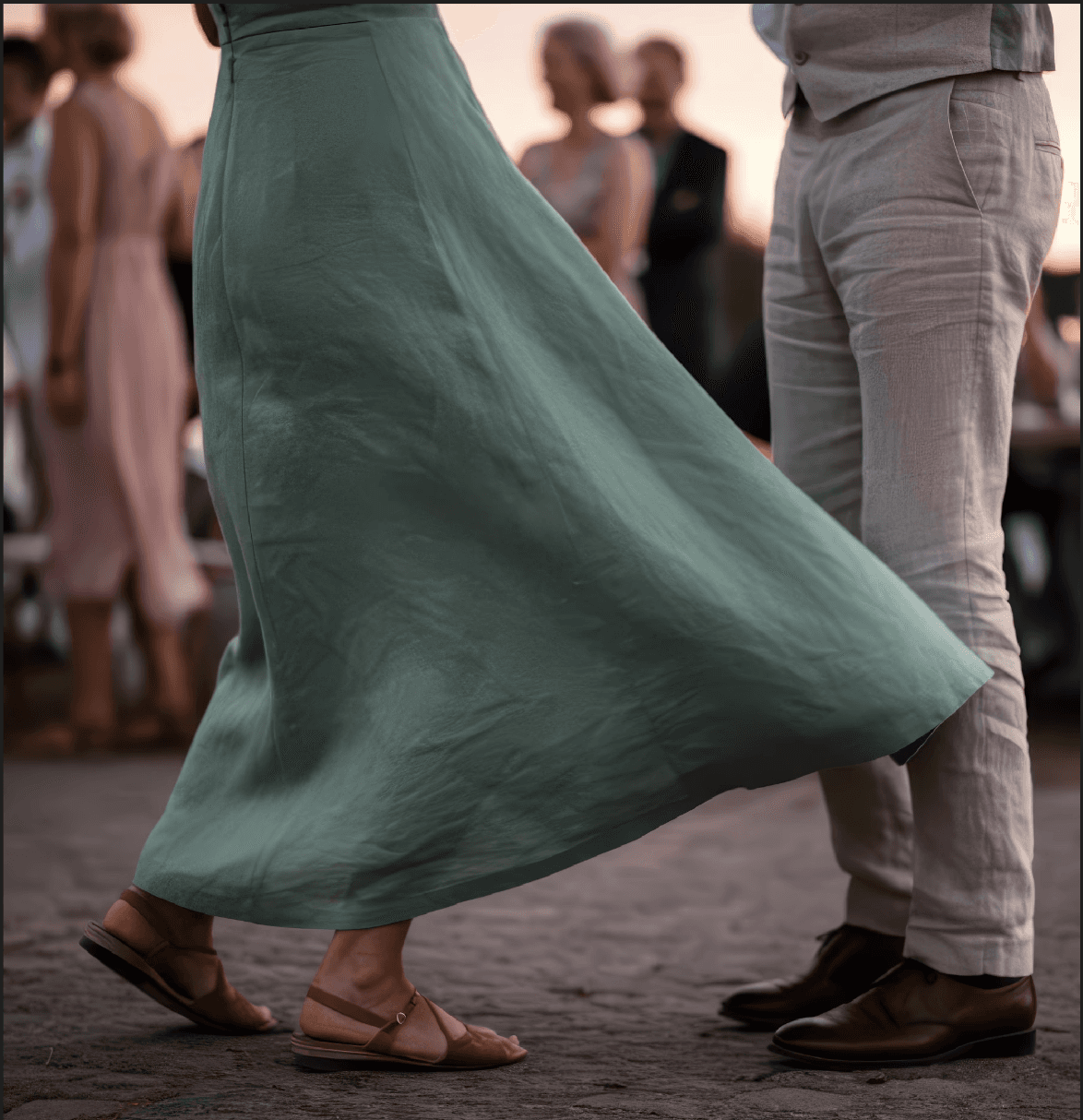 A beautifully set dining table with white tablecloth, cutlery, and fresh greenery in a cozy, well-lit space.