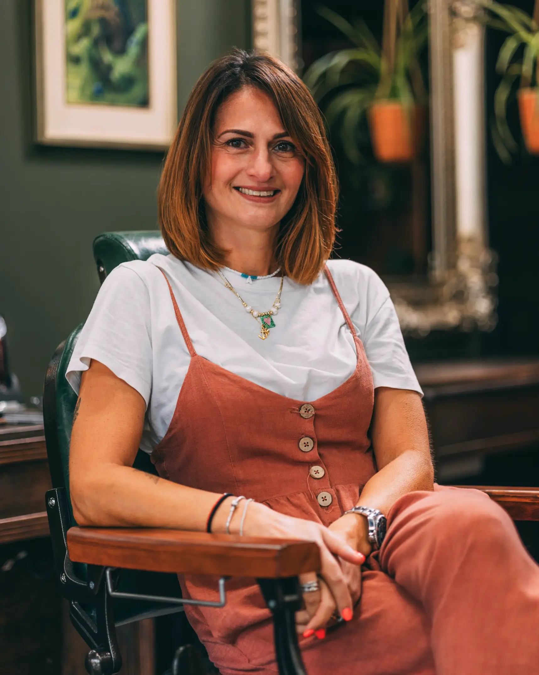 Female Barber Cutting a Man's Hair