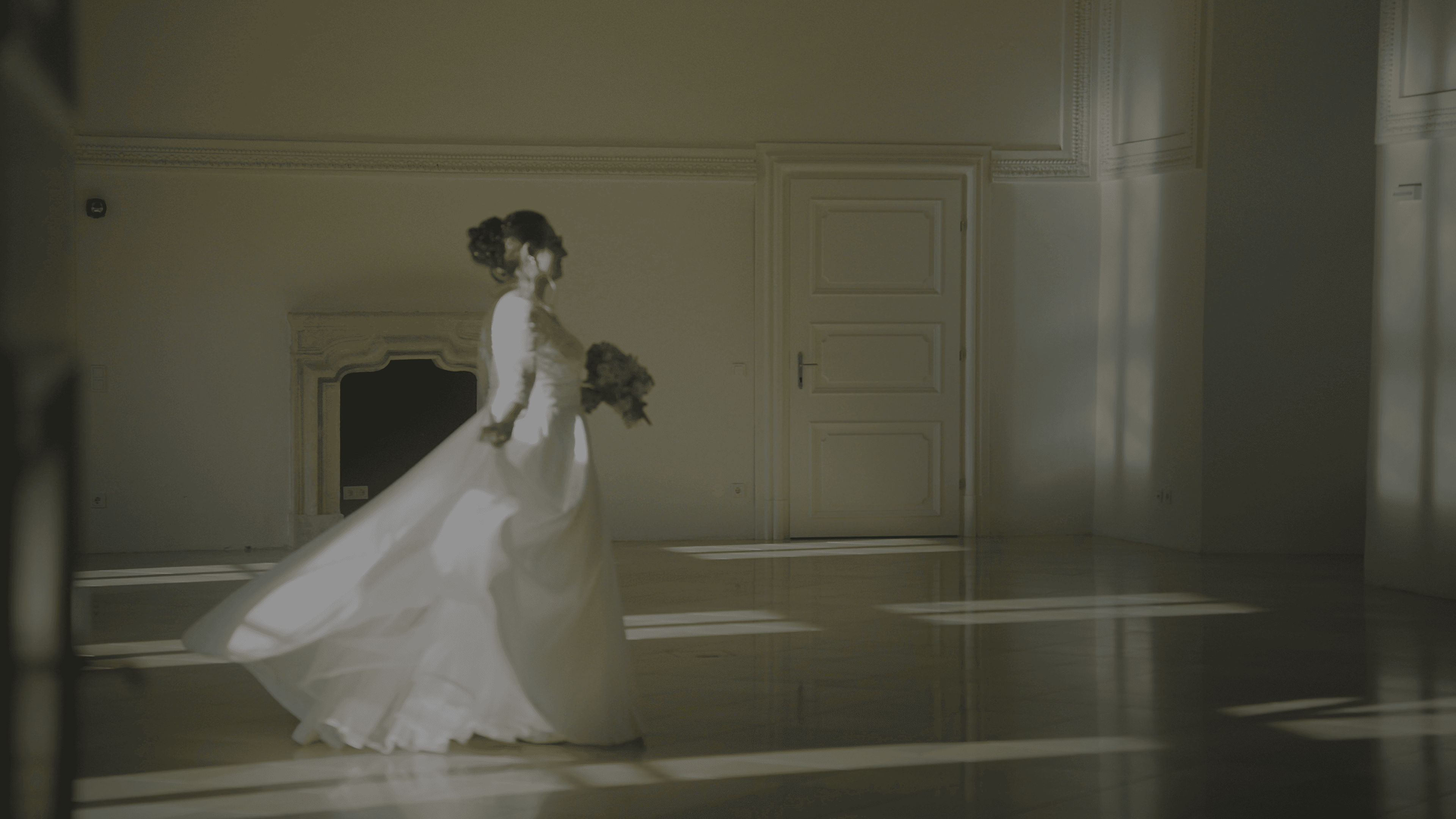 Bride moving gracefully through light and shadow during an intimate destination wedding moment