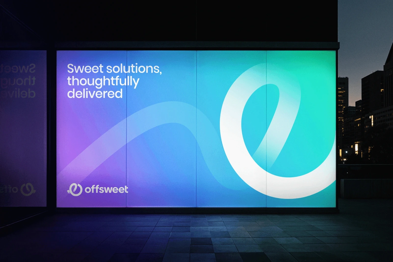 Modern Offsweet advertising display featuring a vibrant blue, purple, and teal gradient background, clean typography, and abstract ribbon graphics on a large illuminated city billboard at night.