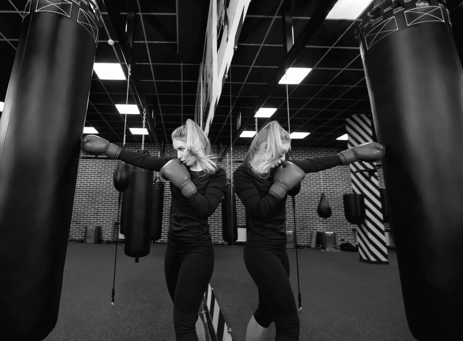 two woman boxing in the gym