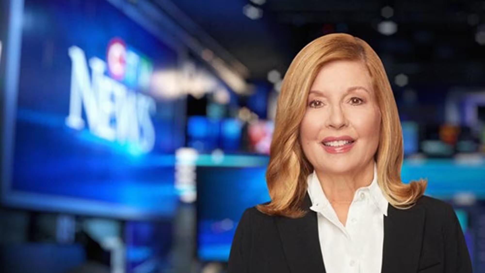 Sandie Rinaldo, iconic Canadian news anchor, looking composed and professional, with a confident gaze.