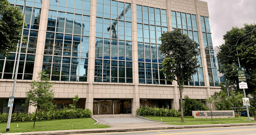 Modern Singaporean office building exterior where AltoTech implemented waterside-airside integration system achieving BCA GreenMark Platinum certification with 20% efficiency improvement