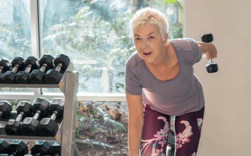 senior woman lifting weights