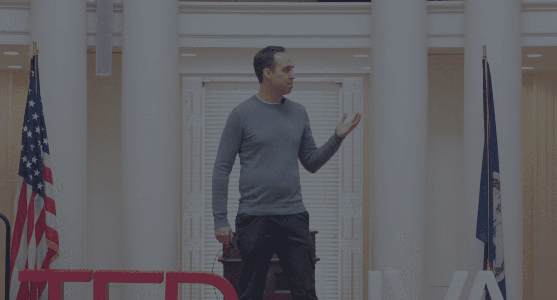 Greg Harrell-Edge on stage at a nonprofit leadership event