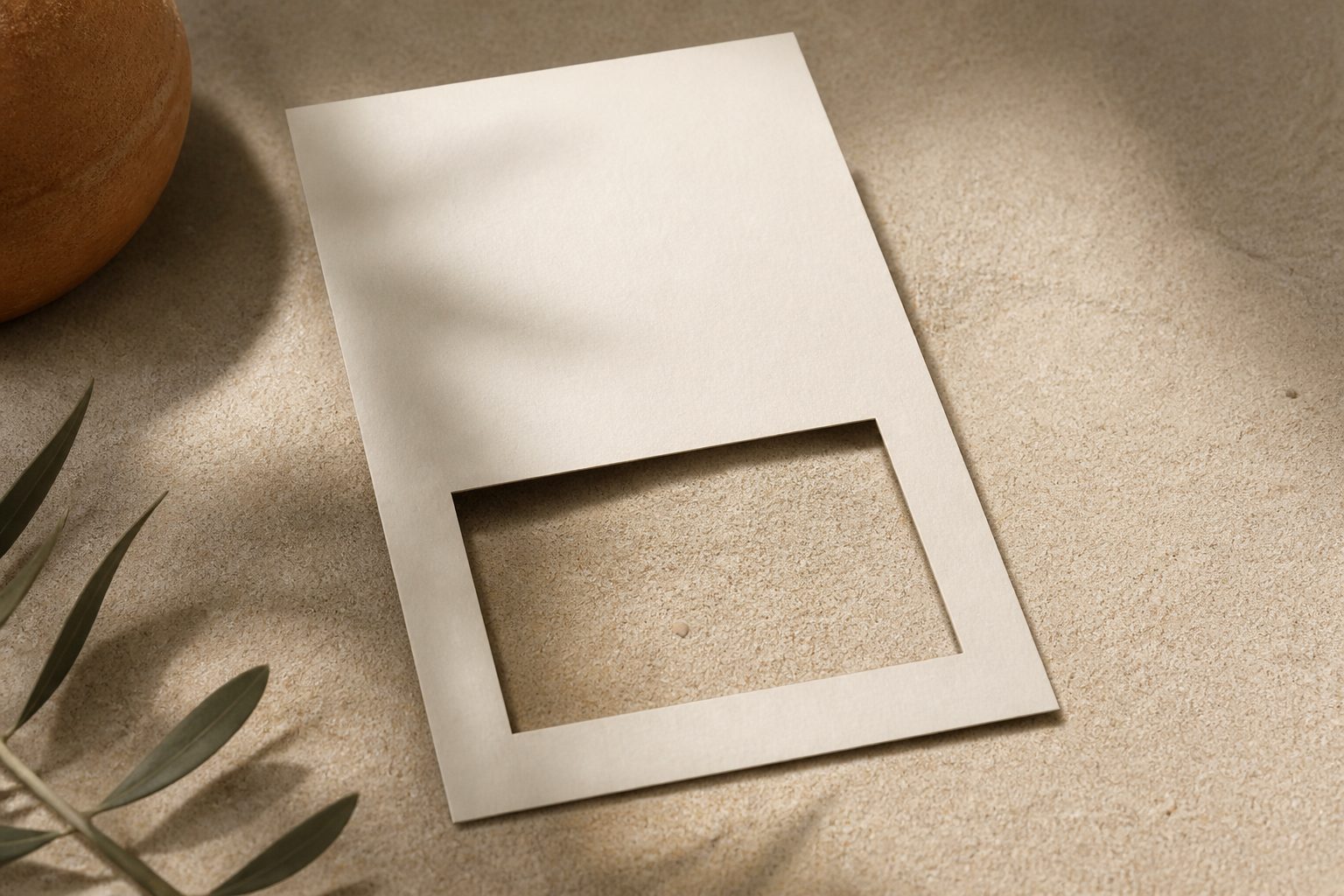 A cream document with a rectangular hole cut from its lower half