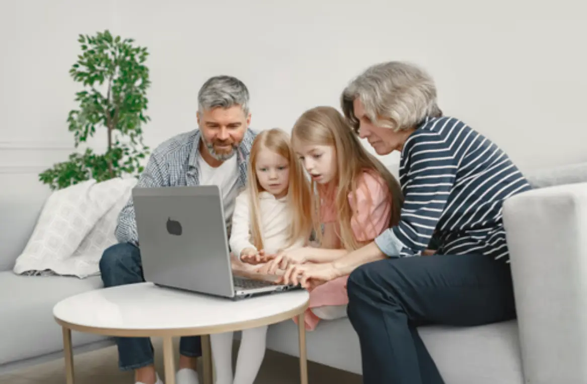 two people looking at a tablet and smiling